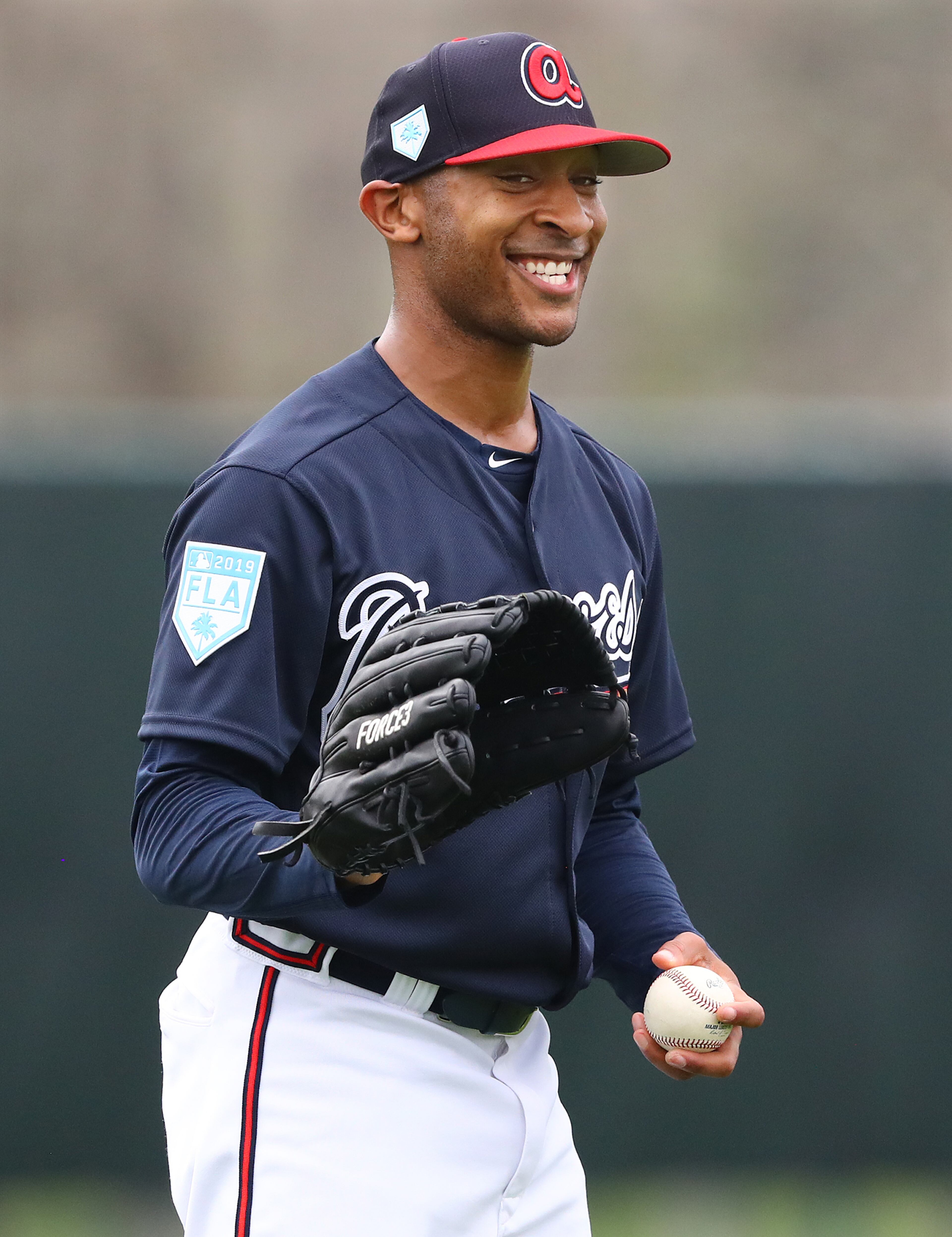 Pitcher Sam Freeman is all smiles as he loosens up. (Curtis Compton/ccompton@ajc.com)
