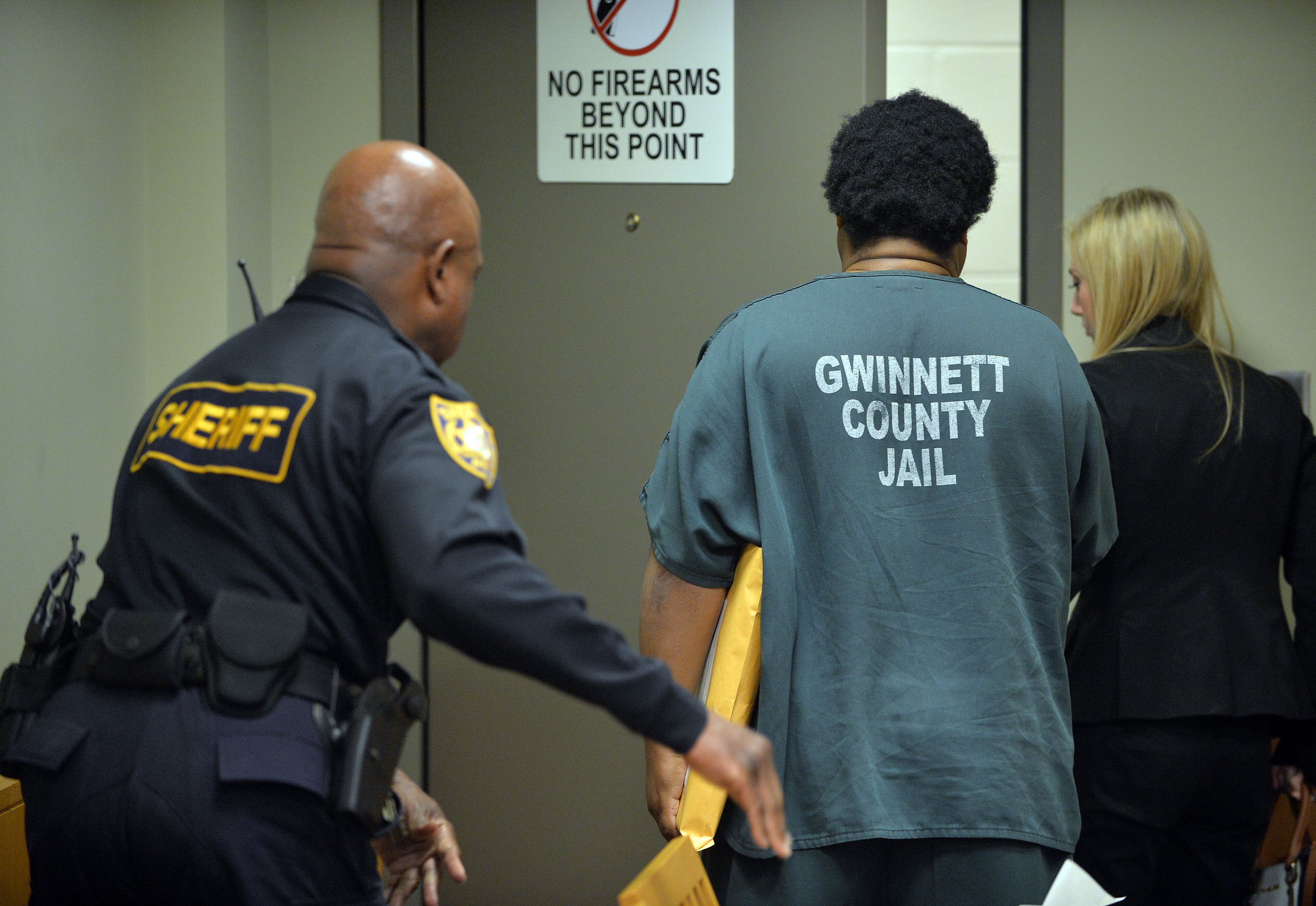 Calvin Mcintosh leaves the courtroom after being bound over for trial. Chief Magistrate Kristina Hammer Blum presides over hearing for a Gwinnett man and his daughter who are charged with starving the man's child to death and withholding food from the child's 21-year-old mother, who weighed 59 pounds when she was found. Calvin Mcintosh ntosh and his daughter, Najlaa, appear in the probable cause hearing Friday, December 5, 2014. Judge Blum found there was probably cause for cruelty to children and murder charges and bound their case over to Superior Court. She said that due to the charges, the court did not have jurisdiction to set a bond. KENT D. JOHNSON/KDJOHNSON@AJC.COM