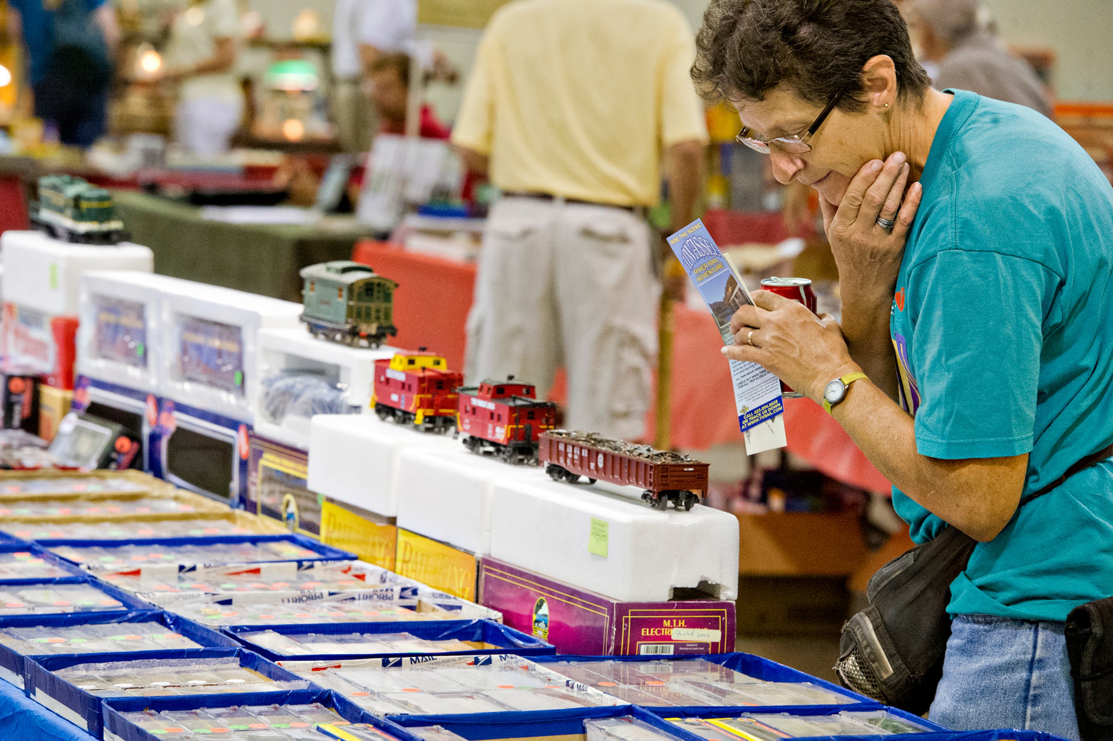 Helen Beatty looks at railroad cars for sale during the 47th Atlanta Model Train and Railroadiana Show and Sale at the North Atlanta Trade Center in Norcross on Saturday, August 9, 2014. The show featured over 300 tables representing dealers from all over the nation showing railroad model items in all gauges as well as railroad antiques. JONATHAN PHILLIPS / SPECIAL