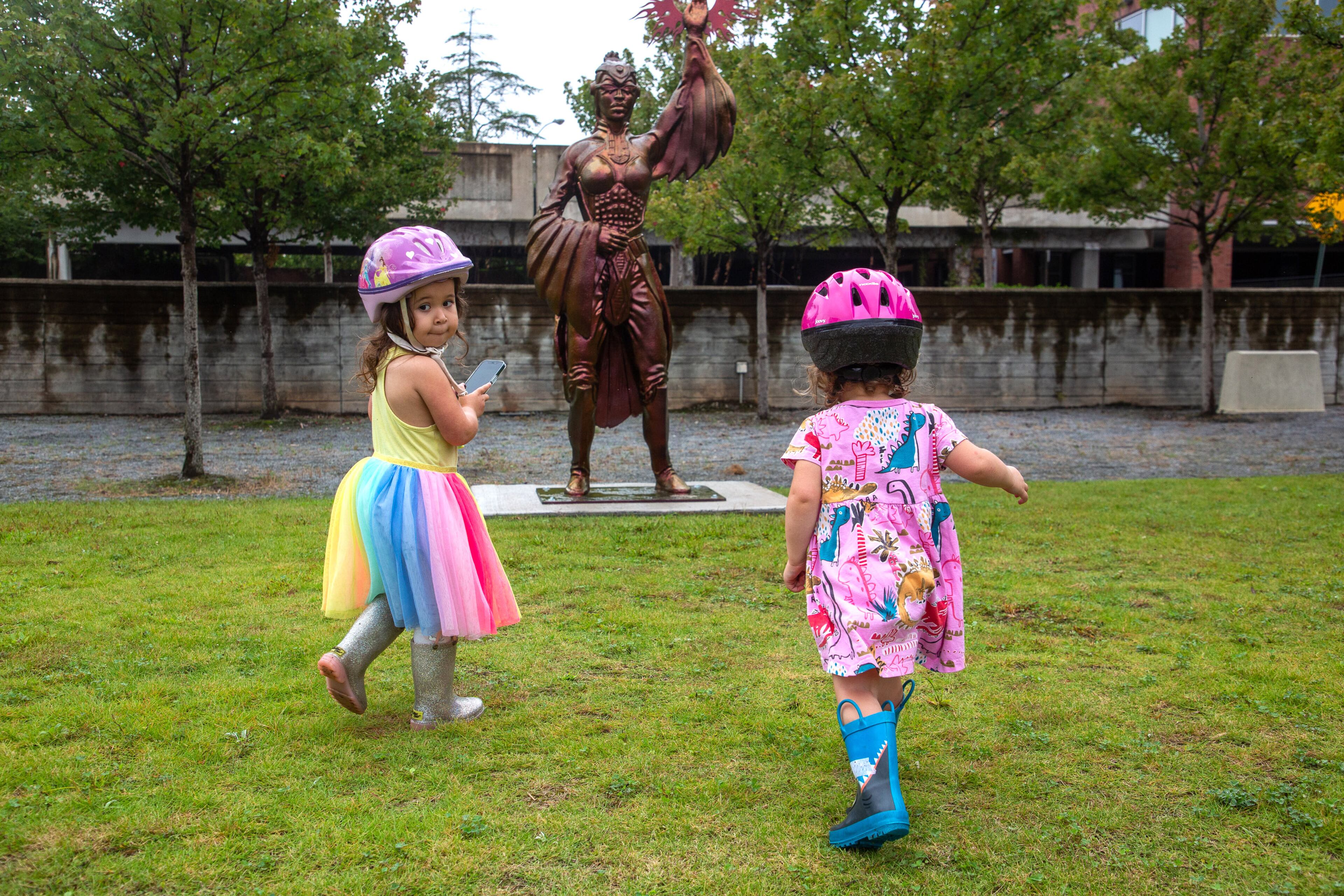 Esme Meraz (left) and her sister Nina play around the new public art sculpture by artist Ellex Swavoni located in the Beacon Municipal Center Plaza in Decatur on Sunday, September 19, 2021. “What Sonia Said” is the name of the phoenix unveiled in a ceremony the previous Sunday. STEVE SCHAEFER FOR THE ATLANTA JOURNAL-CONSTITUTION