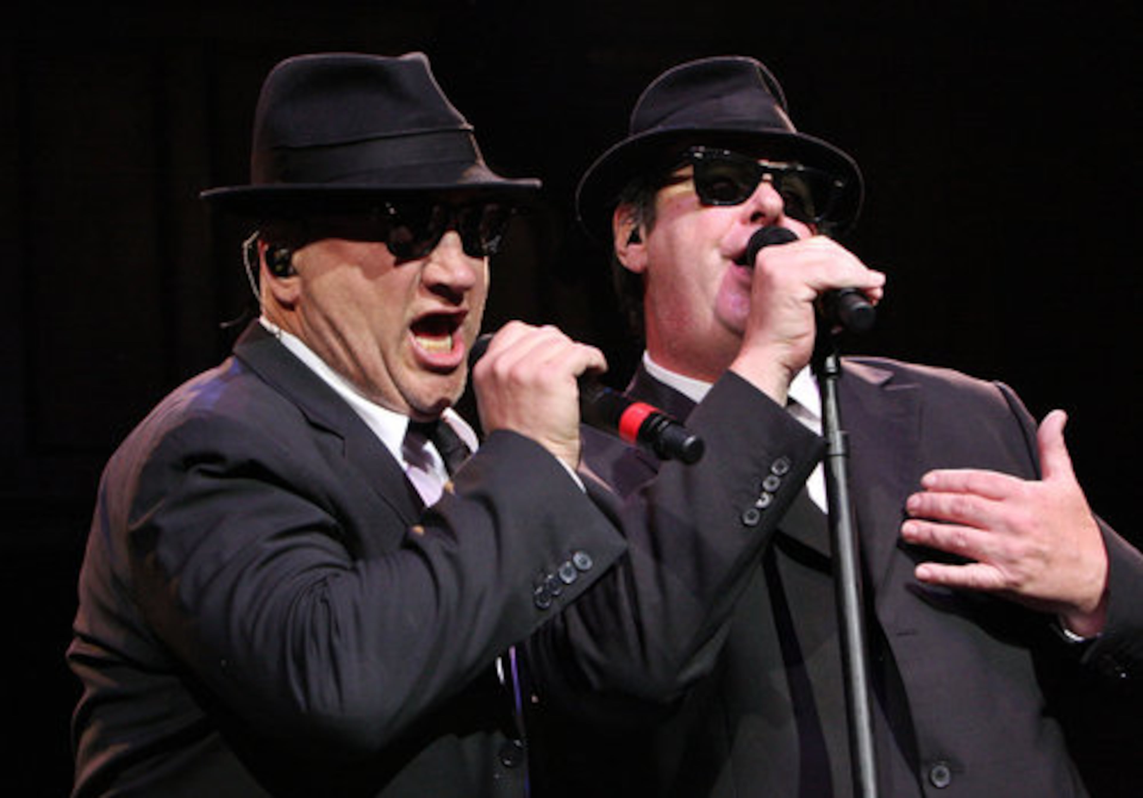 Performing as Elwood and Zee Blues, Dan Aykroyd (right) and Jim Belushi take the stage Saturday night, Feb. 7, 2009, at the Tabernacle in Atlanta. The appearance was a benefit for Hillels of Georgia, a nonprofit that supports Jewish values.
