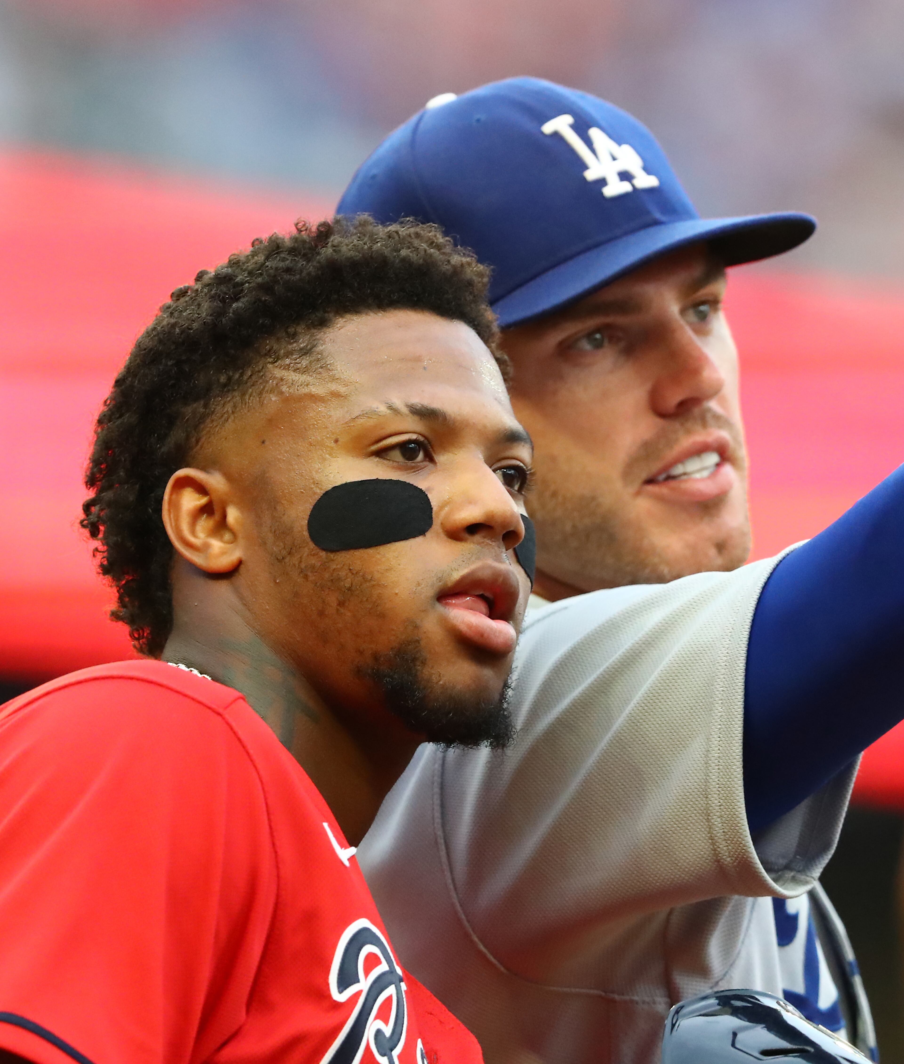 062422 Atlanta: Atlanta Braves outfielder Ronald Acuna and Los Angles Dodgers first baseman Freddie Freeman chat after Acuna draws a walk during the first inning in a MLB baseball game on Friday, June 24, 2022, in Atlanta. “Curtis Compton / Curtis.Compton@ajc.com”