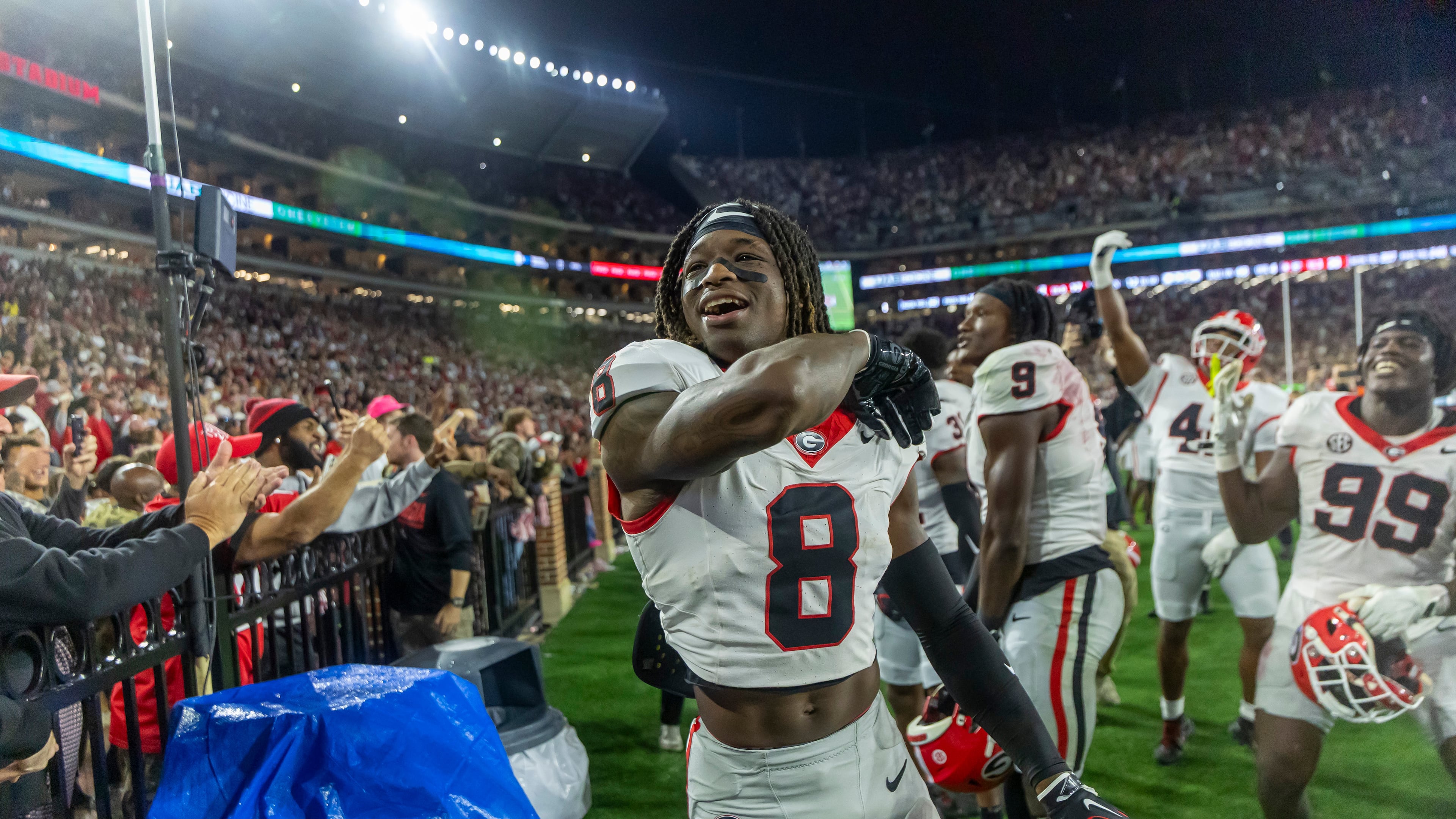 Georgia defensive back Demello Jones (8) celebrates with the fans as the final seconds wind off the clock in a win over Alabama during the second half of an NCAA college football game Saturday, Oct. 10, 2026, in Tuscaloosa, Ala. (AP Photo/Vasha Hunt)