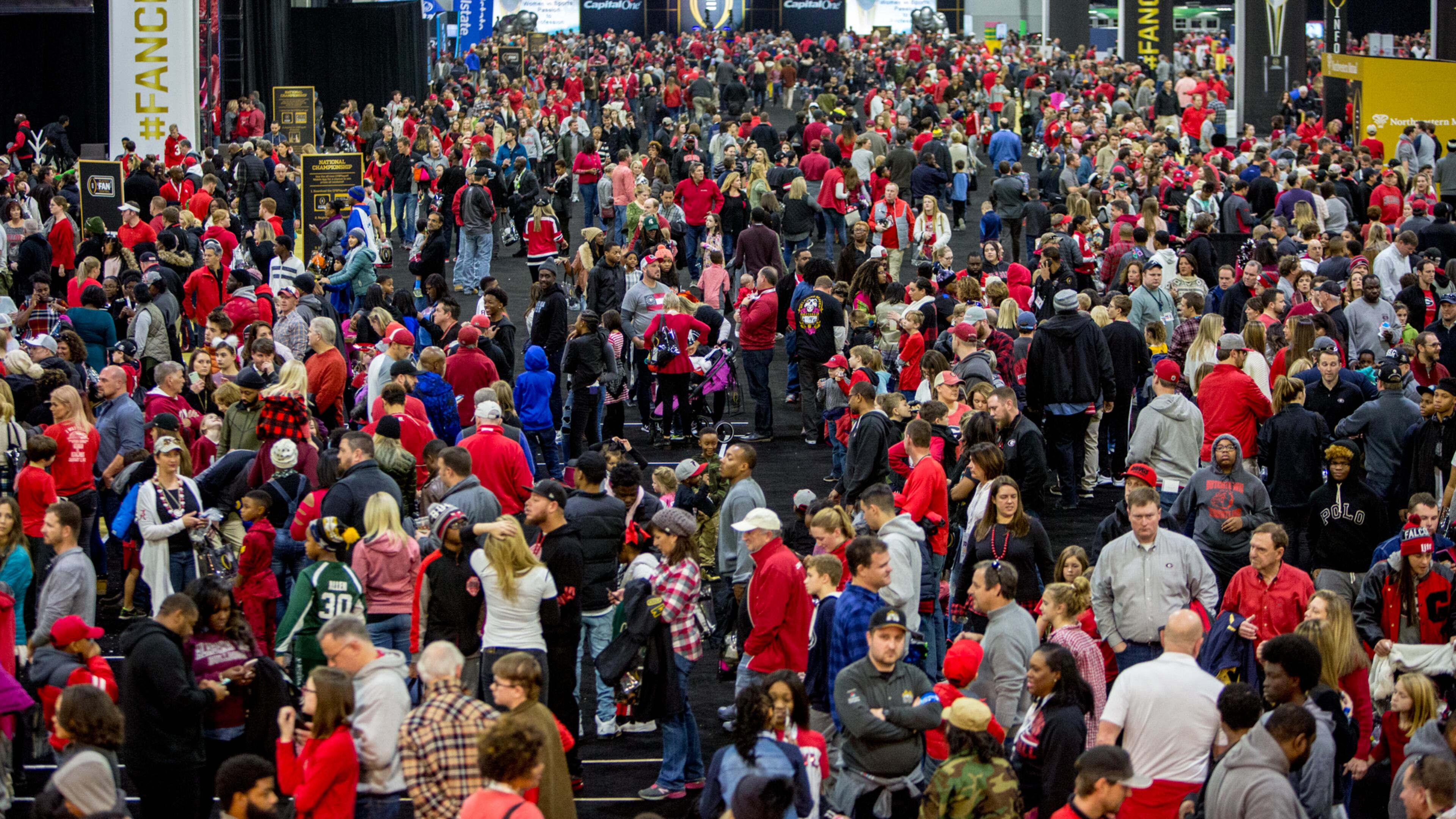 Fans crowd Playoff Fan Central in the Georgia World Congress Center in downtown Atlanta on Sunday. Phil Skinner/AJC