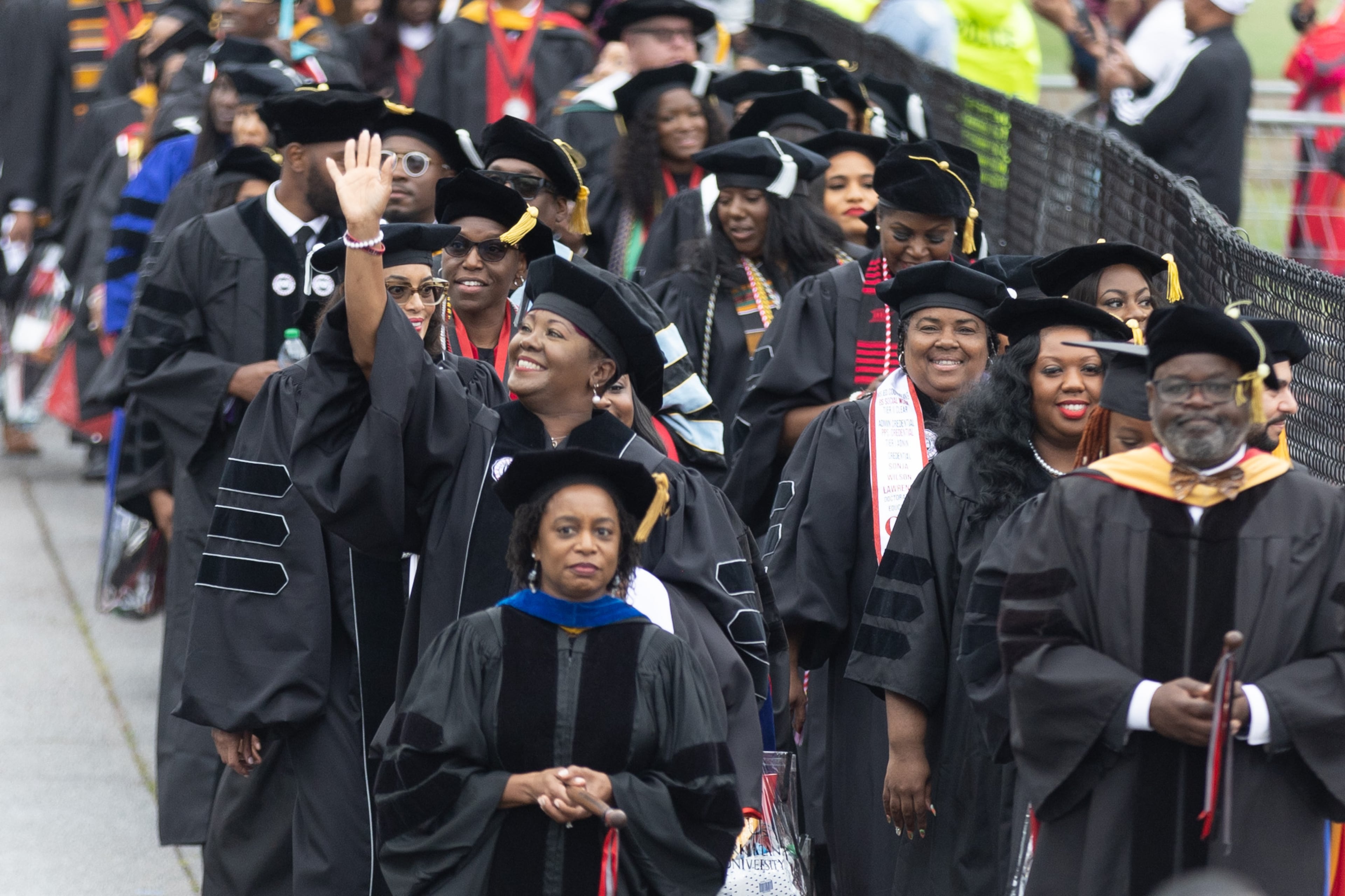 A Clark Atlanta University graduate reacts when seeing her friends and family as she enters Panther Stadium for the commencement ceremony Saturday, May 20, 2023. (Steve Schaefer / steve.schaefer@ajc.com)
