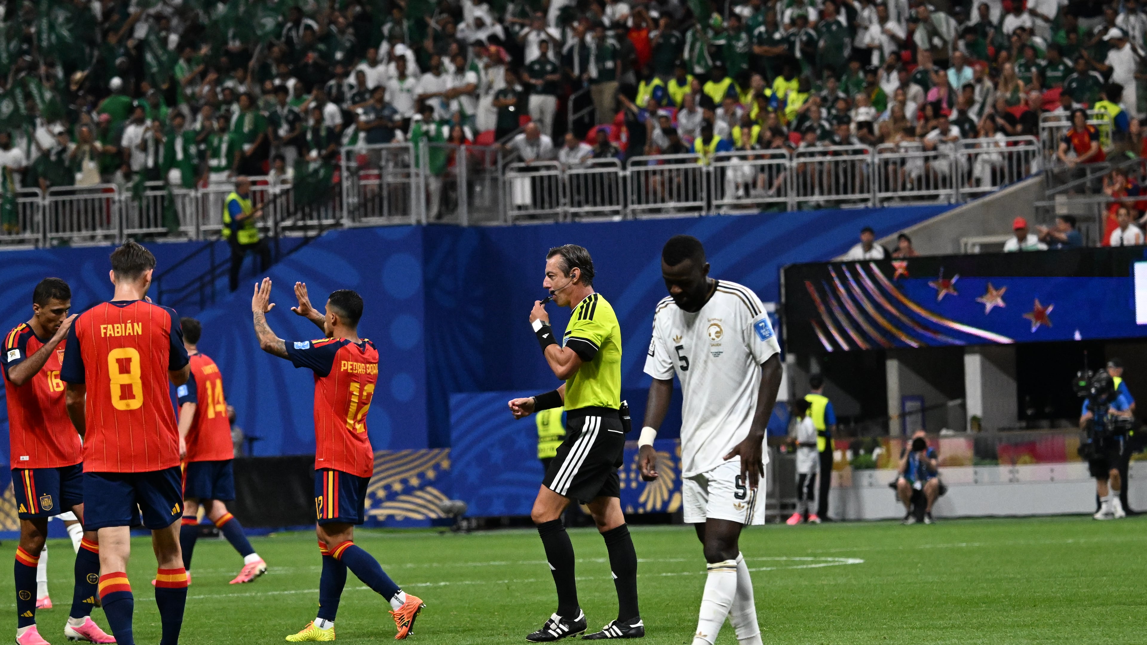 Saudi Arabia's Hassan Altambakti walks off field as Spain celebrates their 4-0 win in Group H FIFA World Cup match at Atlanta Stadium (Mercedes-Benz Stadium) on Sunday, June 21, 2026. (Hyosub Shin/AJC)