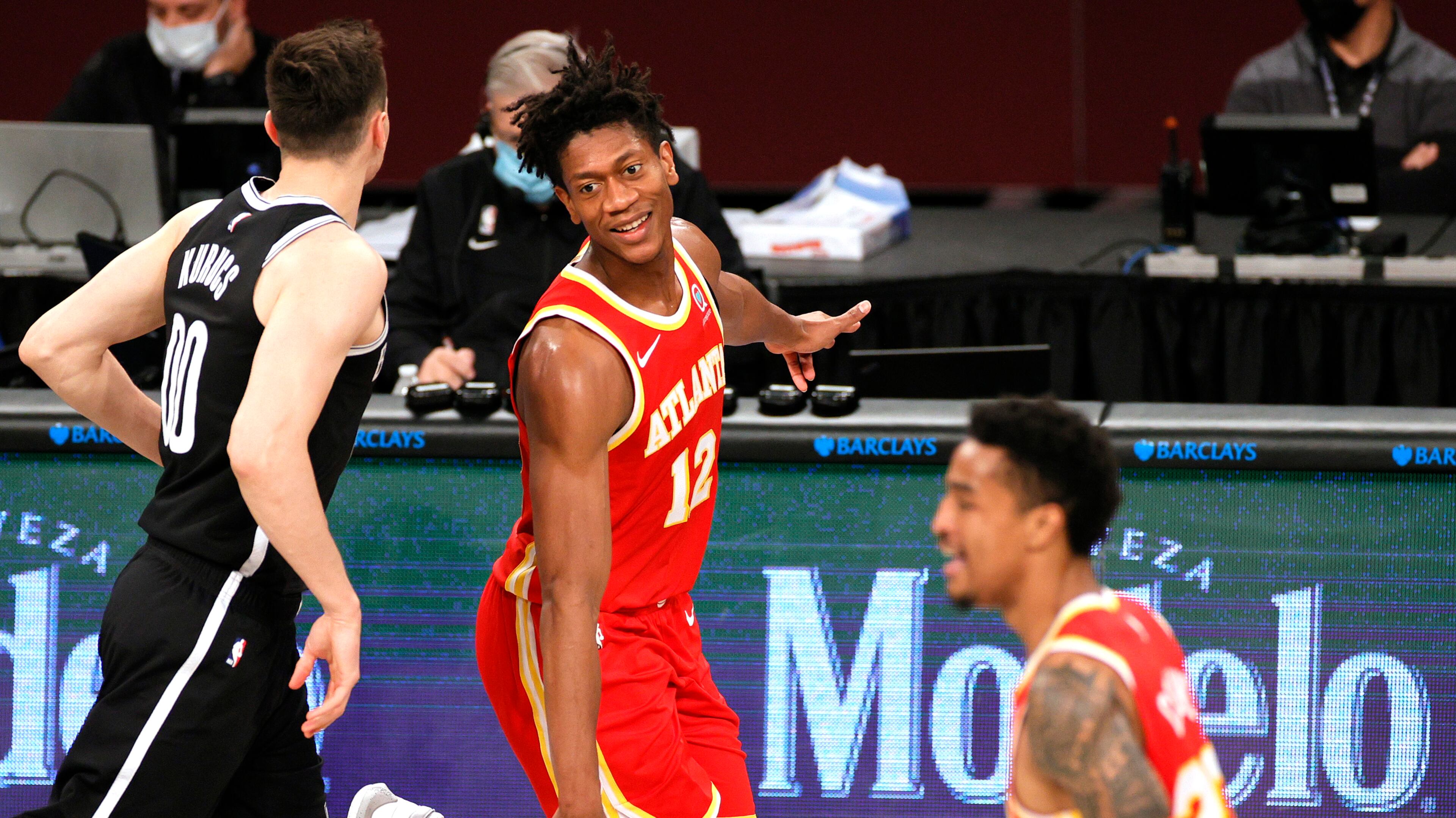 The Atlanta Hawks' De'Andre Hunter (12) reacts during the second half against the Brooklyn Nets at Barclays Center in New York on Friday, Jan. 1, 2021. The Hawks won, 114-96. (Sarah Stier/Getty Images/TNS)