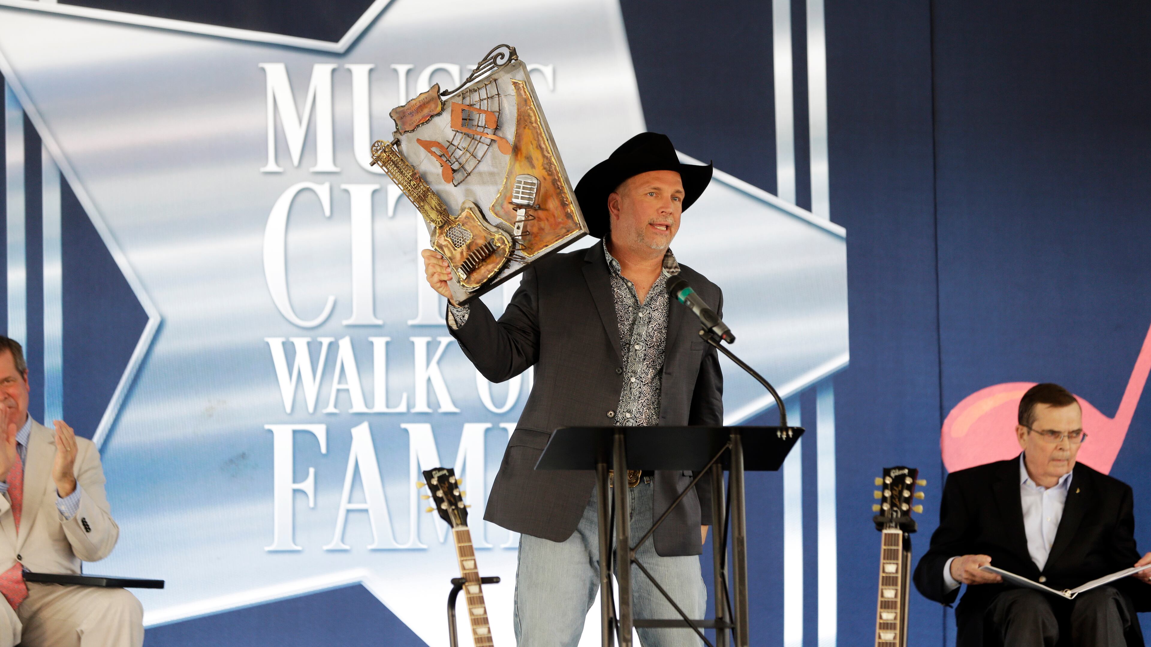 Garth Brooks speaks at a ceremony where he received a star on the Music City Walk of Fame on Thursday, Sept. 10, 2015, in Nashville, Tenn. (AP Photo/Mark Humphrey)