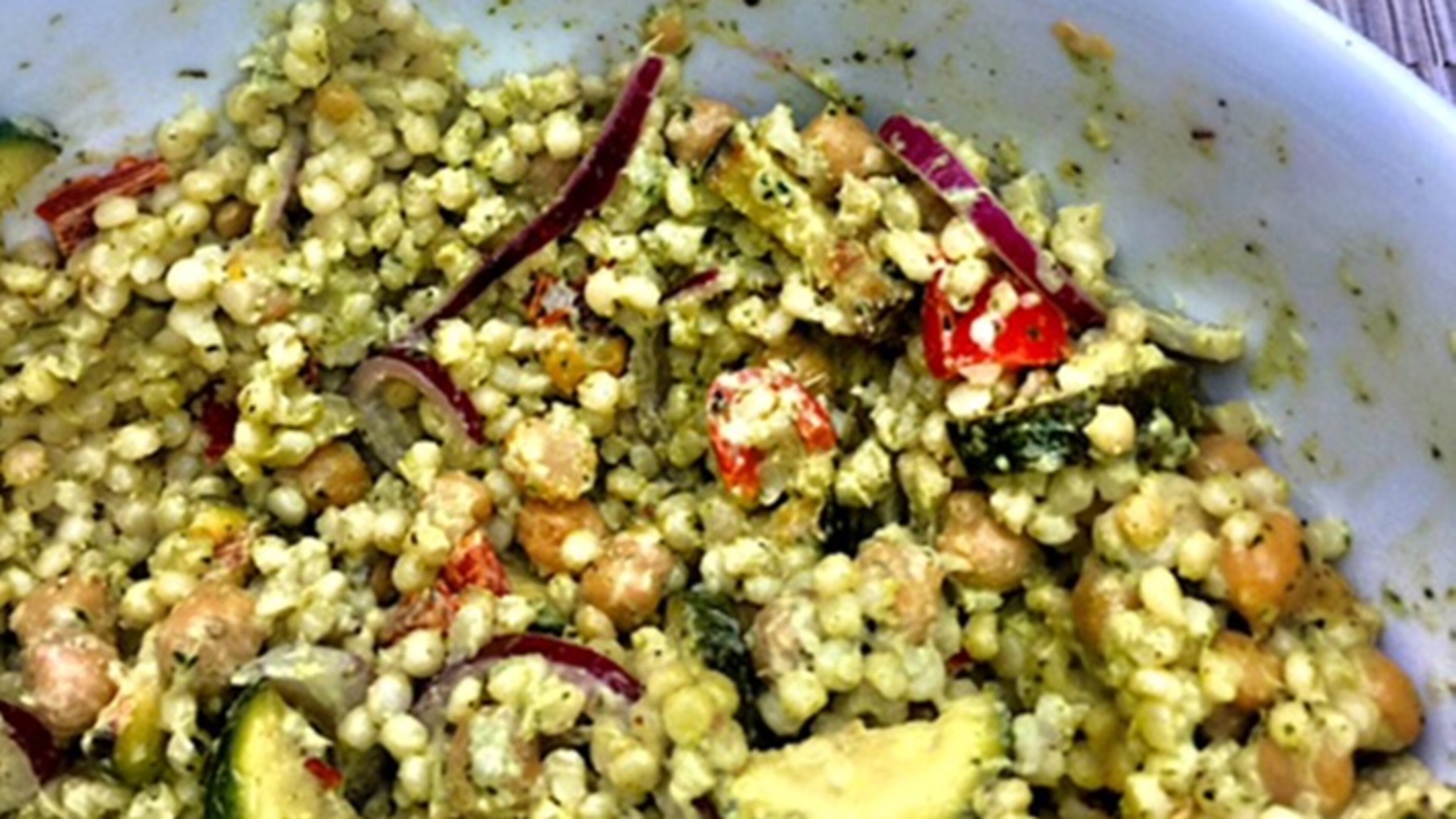 The larger grains of Israeli couscous combine with chickpeas, grilled vegetables and vibrant Green Goddess dressing come together in an excellent salad for late summer. (Kathleen Purvis/Charlotte Observer/TNS)