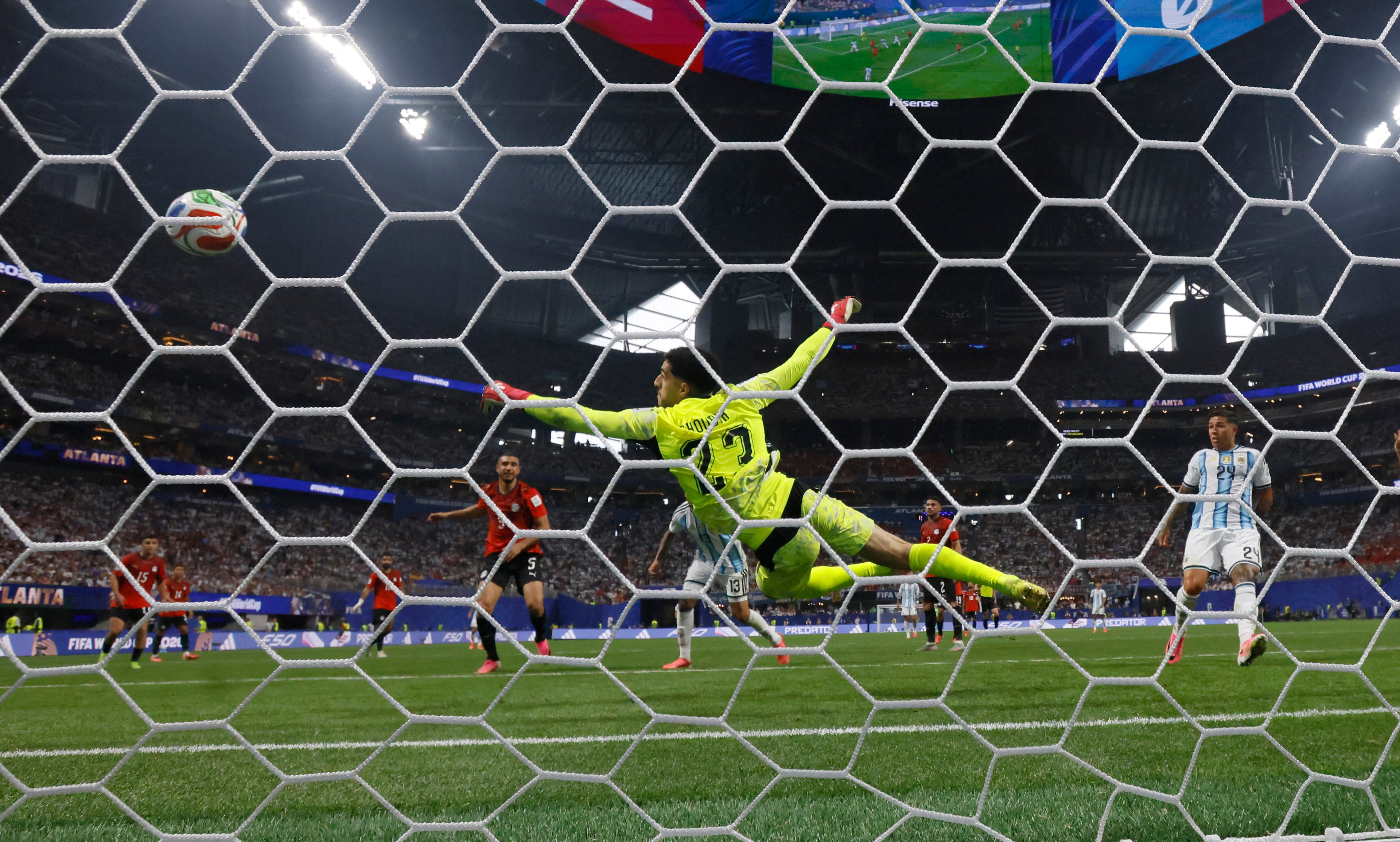 Argentina's Enzo Fernandez watches the goal from teammate and Argentina defender Cristian Romero (13) past Egypt goalkeeper Mostafa Shoubir in a FIFA World Cup match at Atlanta Stadium (Mercedes-Benz Stadium) on Tuesday, July 7, 2026. (Miguel Martinez/AJC)