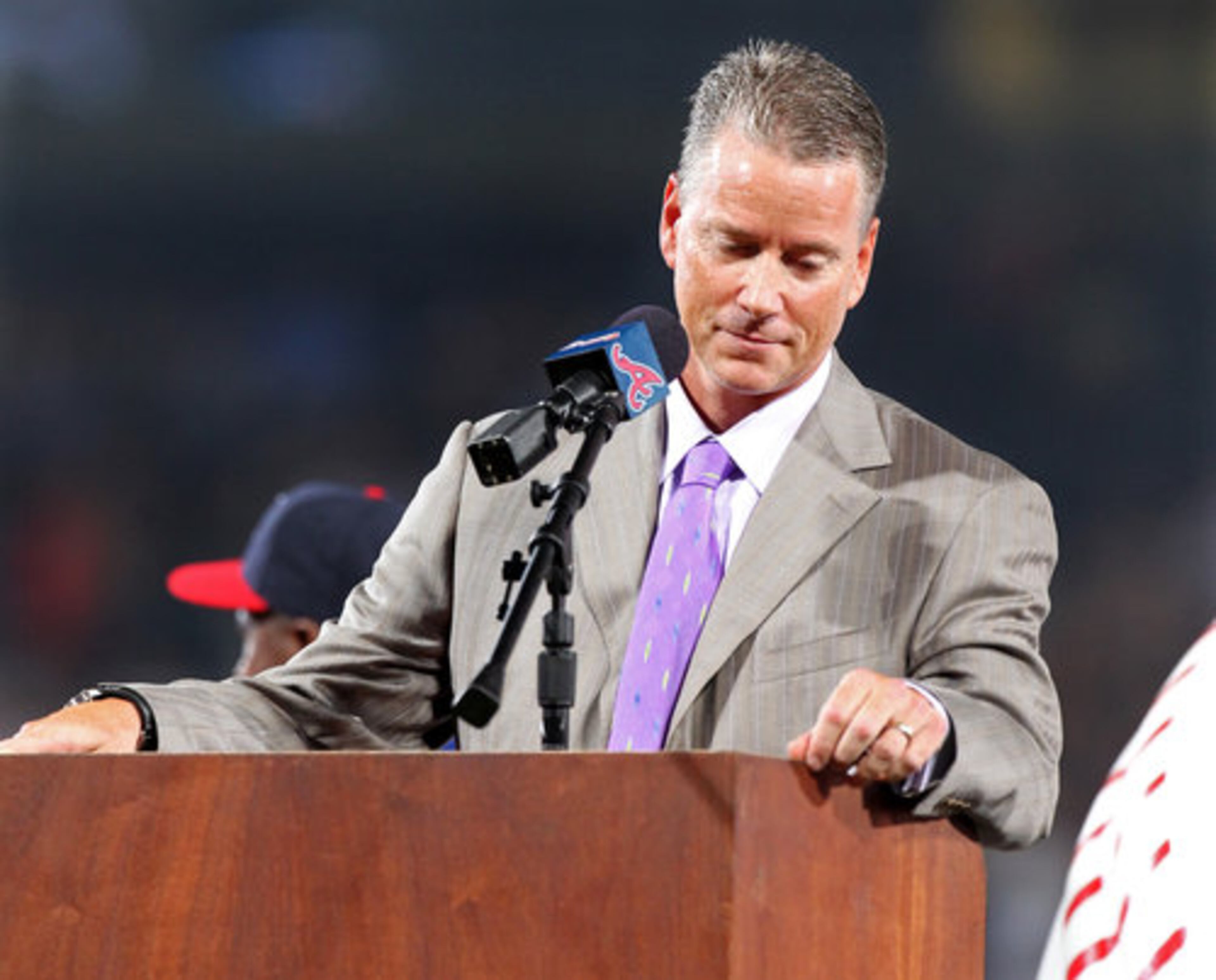 Tom Glavine pauses at the microphone fighting back his emotion during his speech at his uniform number retirement in a pre-game ceremony at Turner Field in Atlanta, Friday, August 6, 2010, before the game vs. the San Francisco Giants. Glavine's # 47 is the seventh Braves uniform number to be retired.