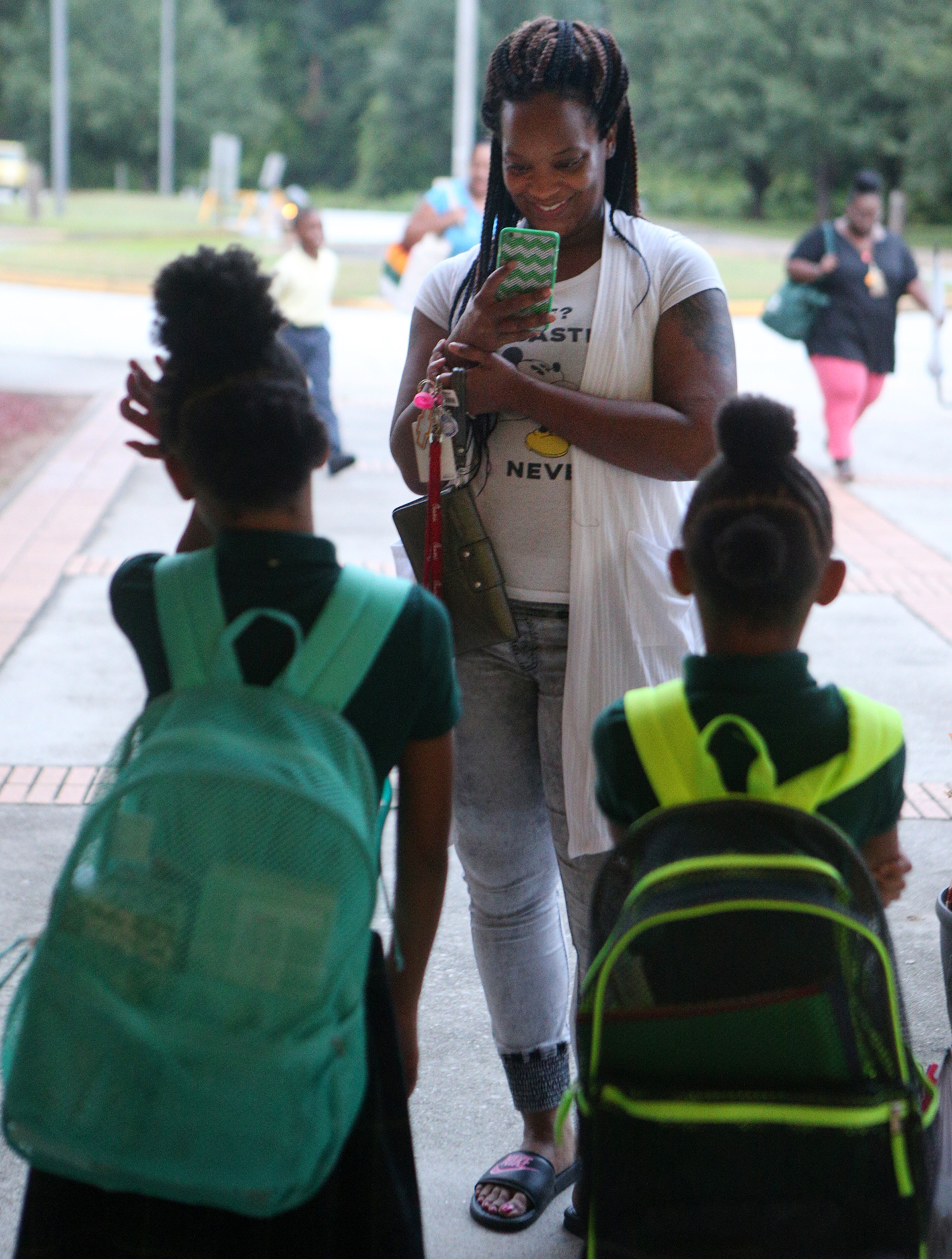 August 7, 2017 Lithonia; Fifth grade student Isaiah Brown, 10, enjoys the freedom of an open hallway as he is the first student to arrive for the first day of school at Edward L Bouie Elementary School on Monday, August 7, 2017, in Lithonia. Curtis Compton/ccompton@ajc.com