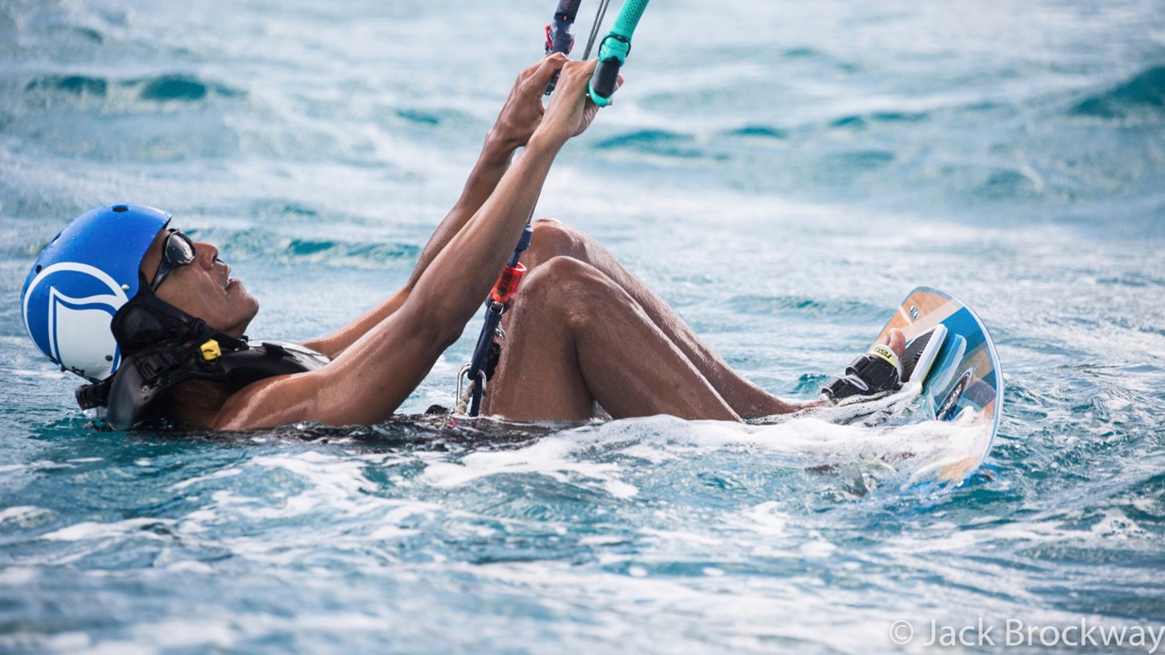 In this recent but undated photo made available by Virgin.com, former U.S President Barack Obama prepares to kitesurf during his stay on Moskito Island, British Virgin Islands. The former president and his wife stayed on Mosikto Island owned by Richard Branson, founder of the Virgin Group, after he finished his second term as President and left the White House. (Jack Brockway/Virgin.com via AP)