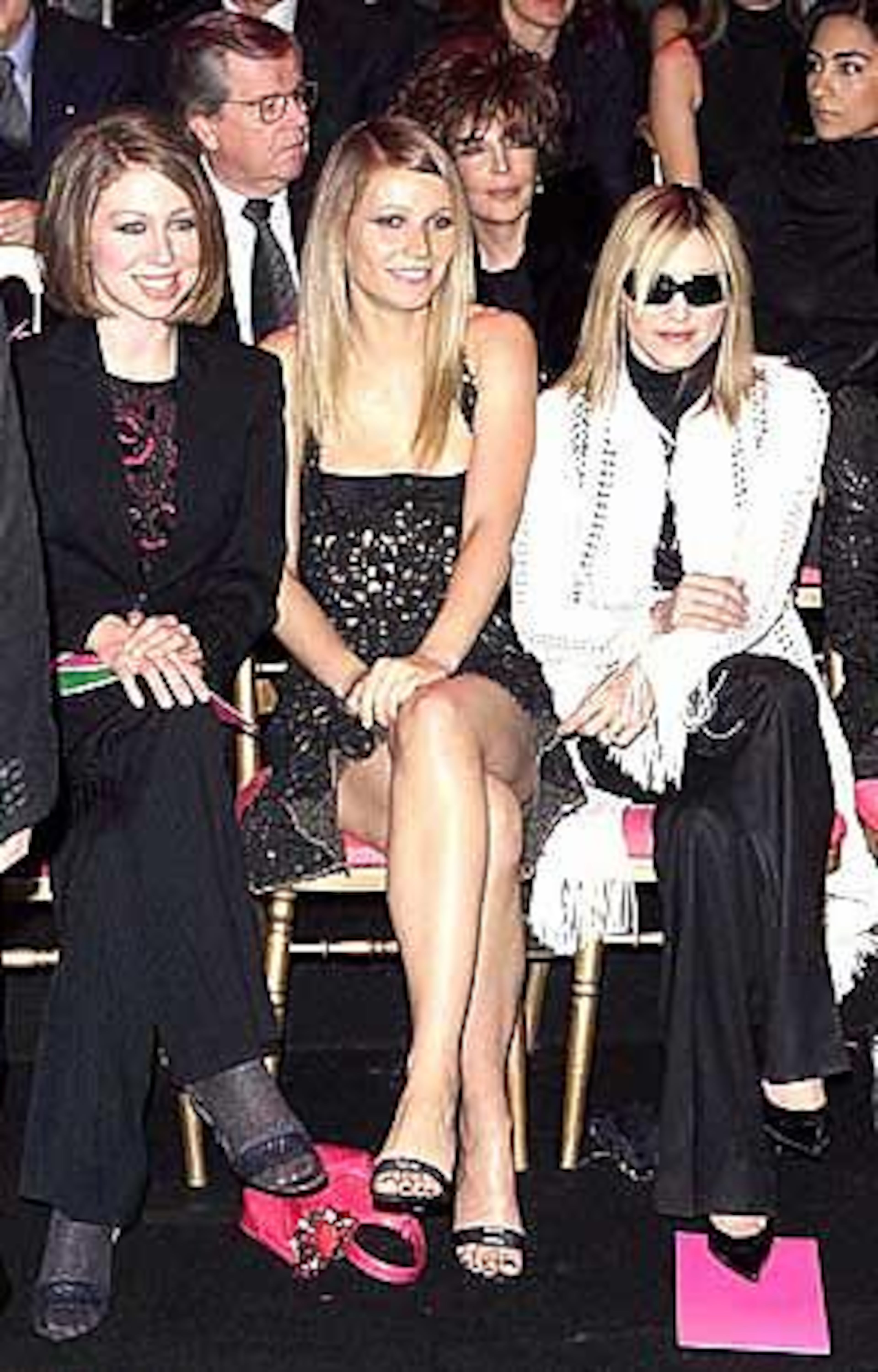 Former American President Bill Clinton's daughter Chelsea Clinton, left, American actress Gwyneth Paltrow, center, and pop star Madonna attend the Versace spring-summer 2002 Haute Couture fashion show in Paris in 2002.