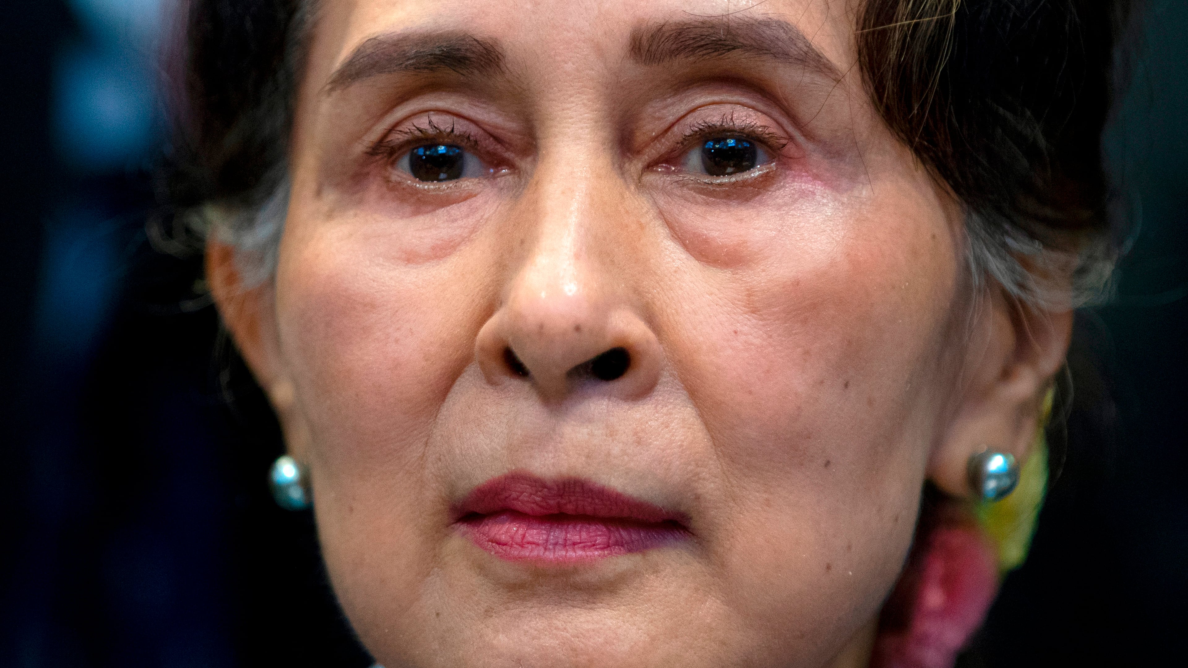 FILE - Myanmar's leader Aung San Suu Kyi waits to address judges of the International Court of Justice on the second day of three days of hearings in The Hague, Netherlands, on Dec. 11, 2019. (AP Photo/Peter Dejong, File)