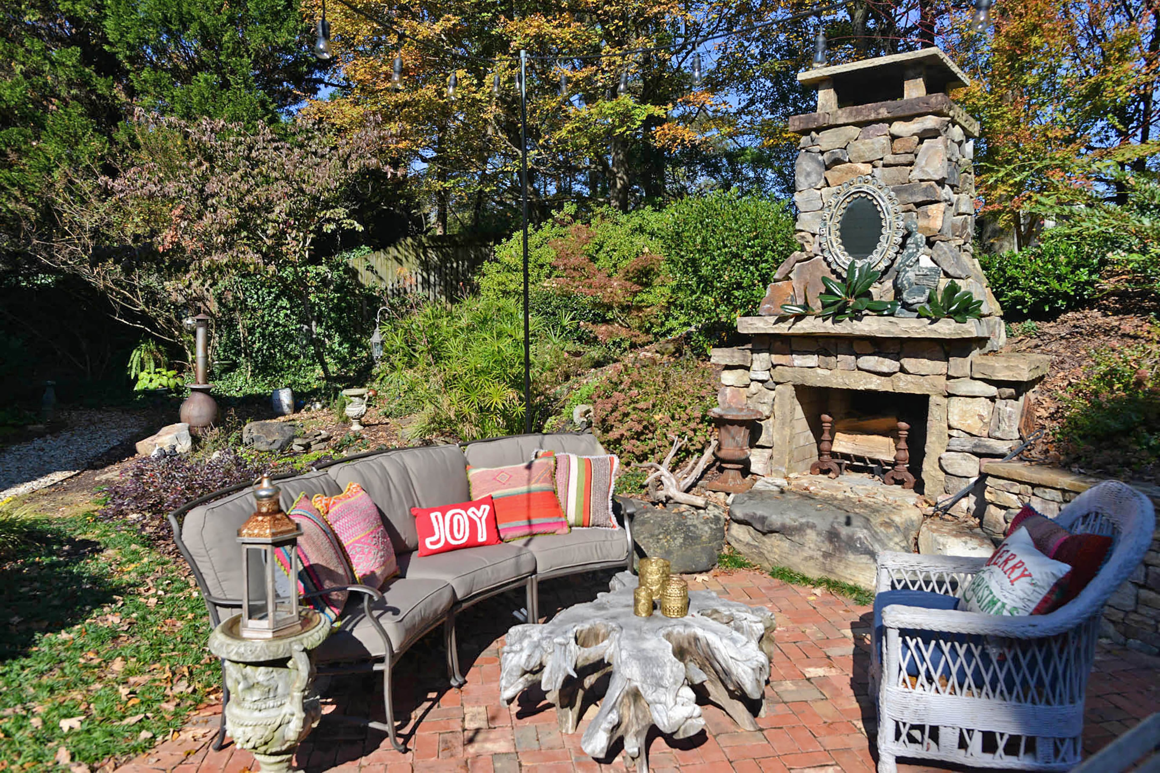 The stone fireplace was added when the Doherty family moved in, and is a stunning focal point in the backyard.