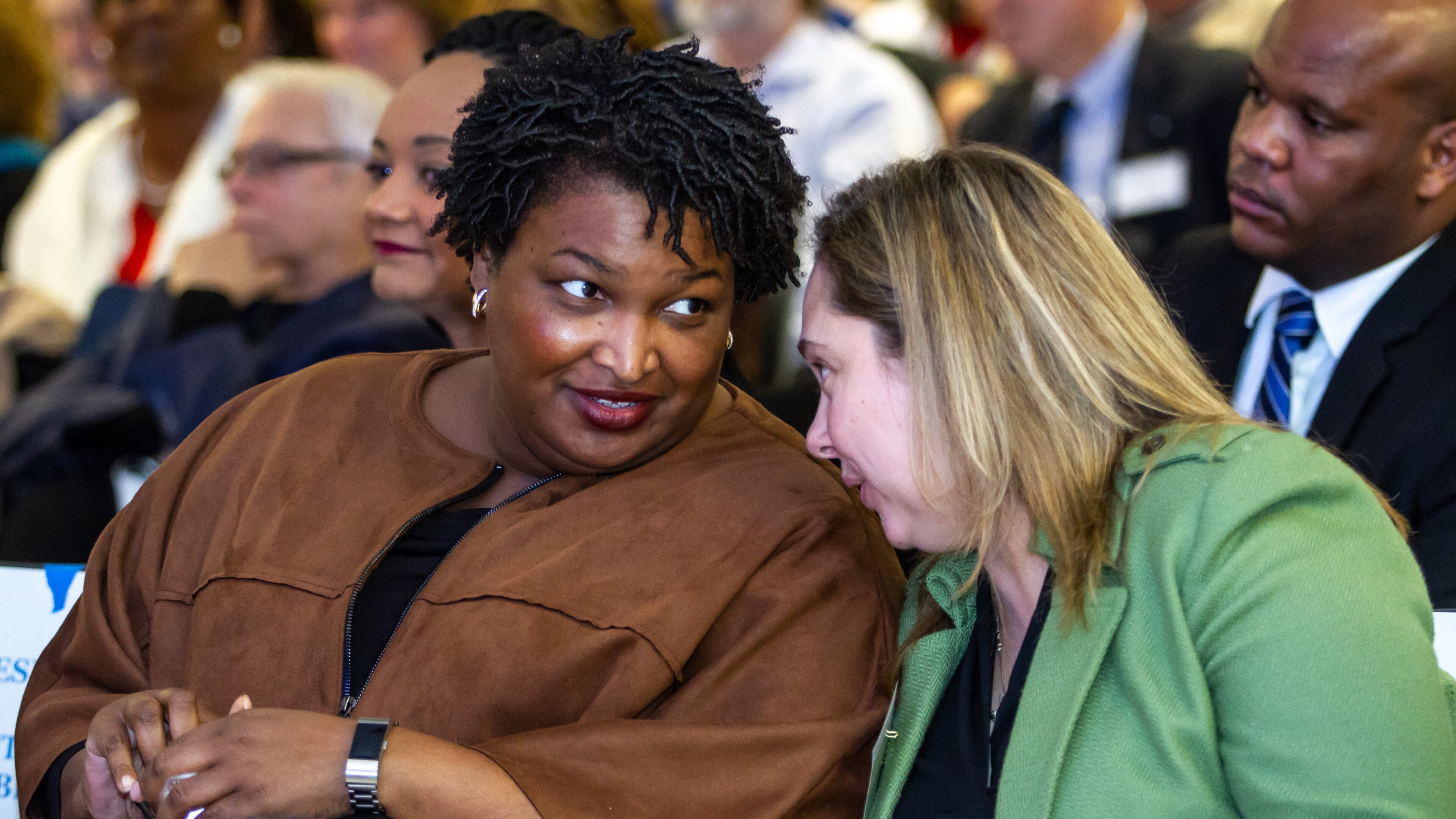 Stacey Abrams, left, talks with Sarah Riggs Amico, the former candidate for lieutenant governor, at last month’s state Democratic conventionSTEVE SCHAEFER / SPECIAL TO THE AJC