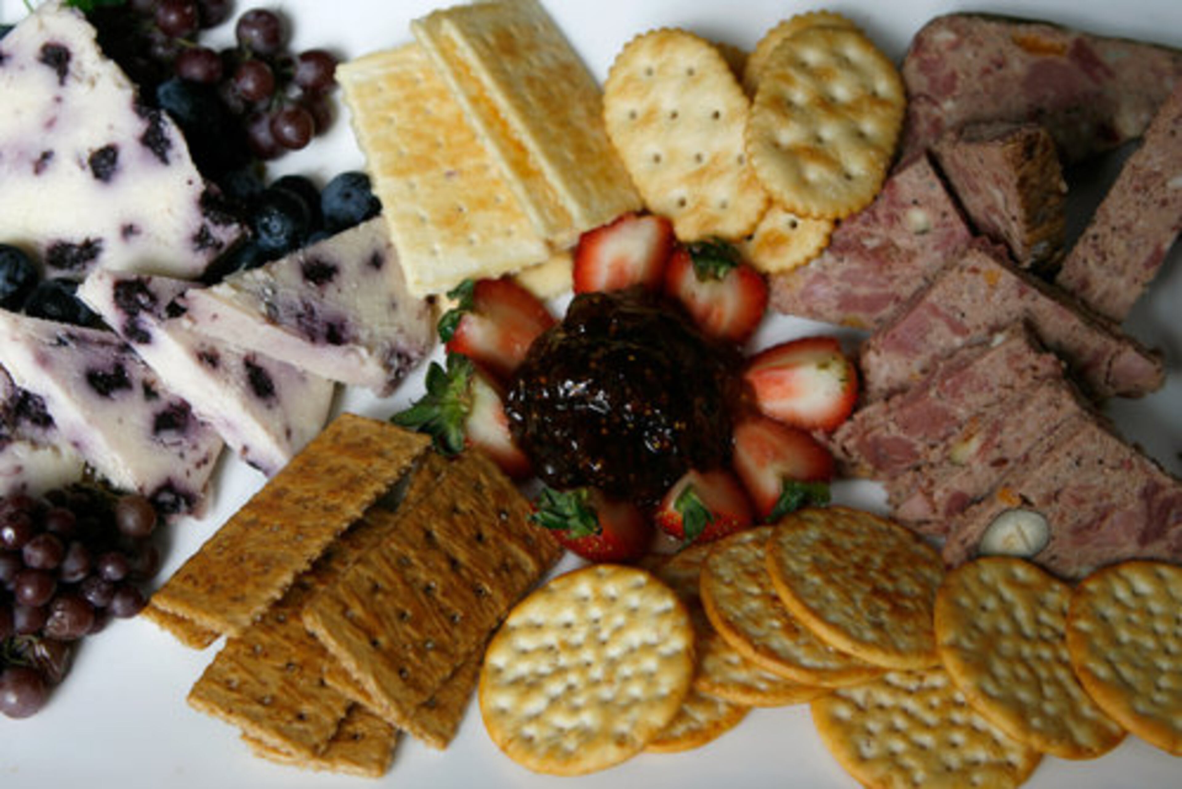 White Stilton cheese, a fig spread and venison pate -- all part of the $1,000 platinum picnic basket, which is available at all Atlanta Symphony Orchestra and ASO Presents concerts at the Verizon Wireless Amphitheatre at Encore Park in Alpharetta. Styled by Ovations Food Service chef Phil Alamio.