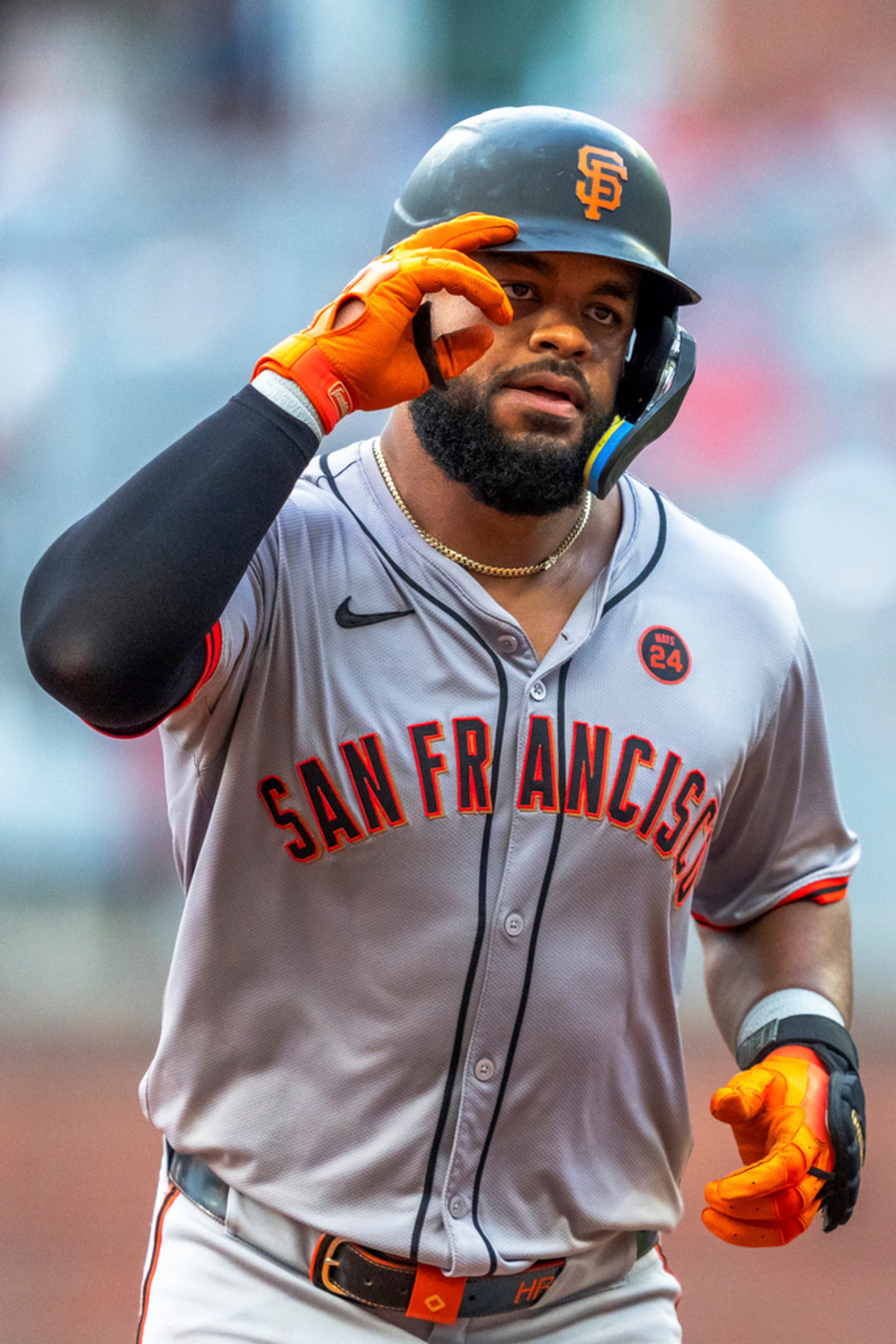 San Francisco Giants Heliot Ramos salutes to the crowd after hitting a home run to center field during the fourth inning of a baseball game against the Atlanta Braves, Thursday, July 4, 2024, in Atlanta. (AP Photo/Jason Allen)