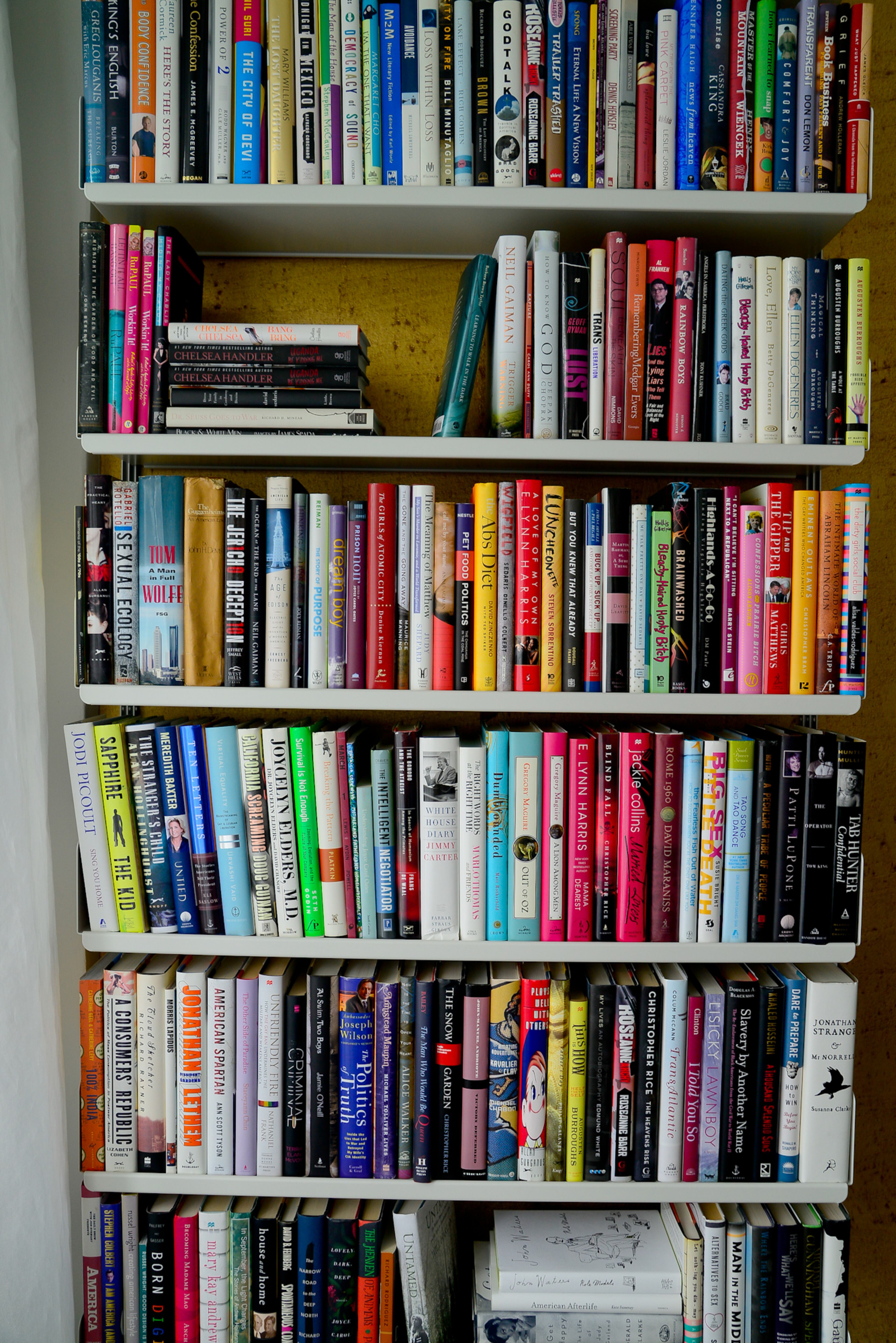 Homeowner Philip Rafshoon, program director for the AJC Decatur Book Festival and former owner of Outwrite Bookstore and Coffeehouse, has hardcover books filling wall-mounted shelves made with powder coated steel, by Vitsoe in New York.