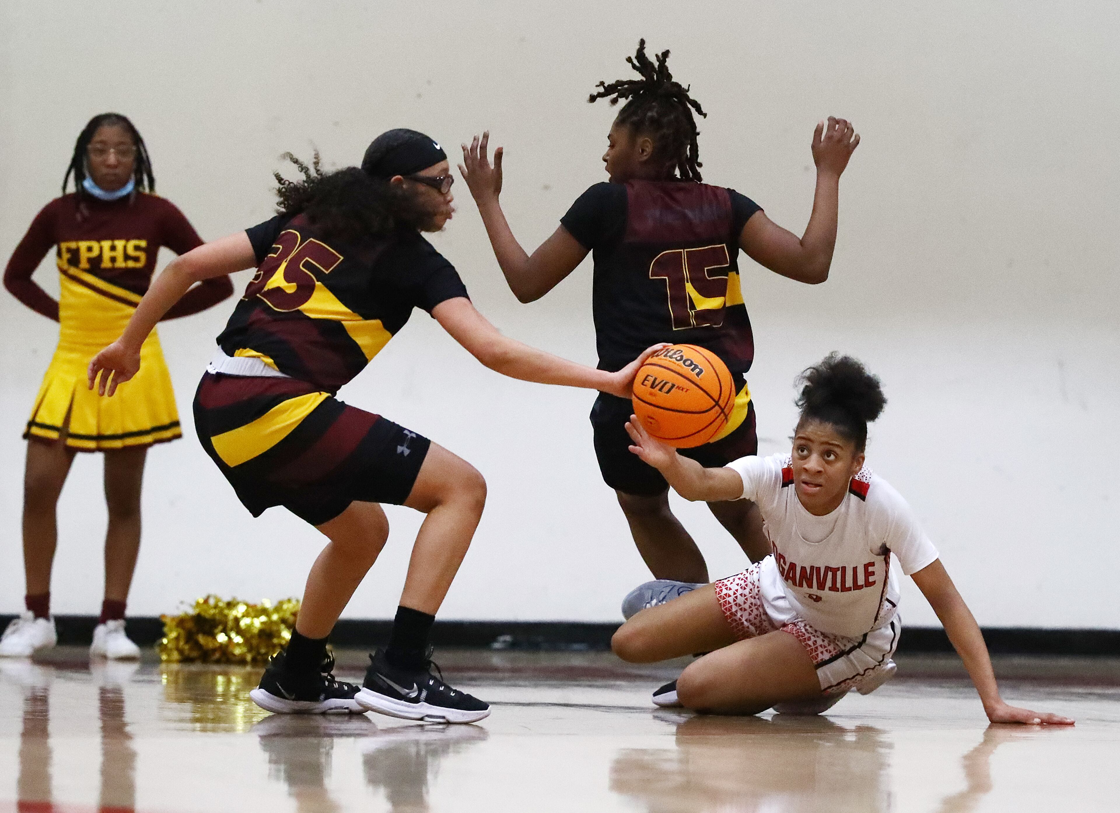 Forest Park guard Yasmine Allen (left) steals from Loganville guard Sydney Bolden on the way to a 52-40 victory over Loganville in their high school basketball tournament game on Wednesday, March 2, 2022, in Loganville. “Curtis Compton / Curtis.Compton@ajc.com”`