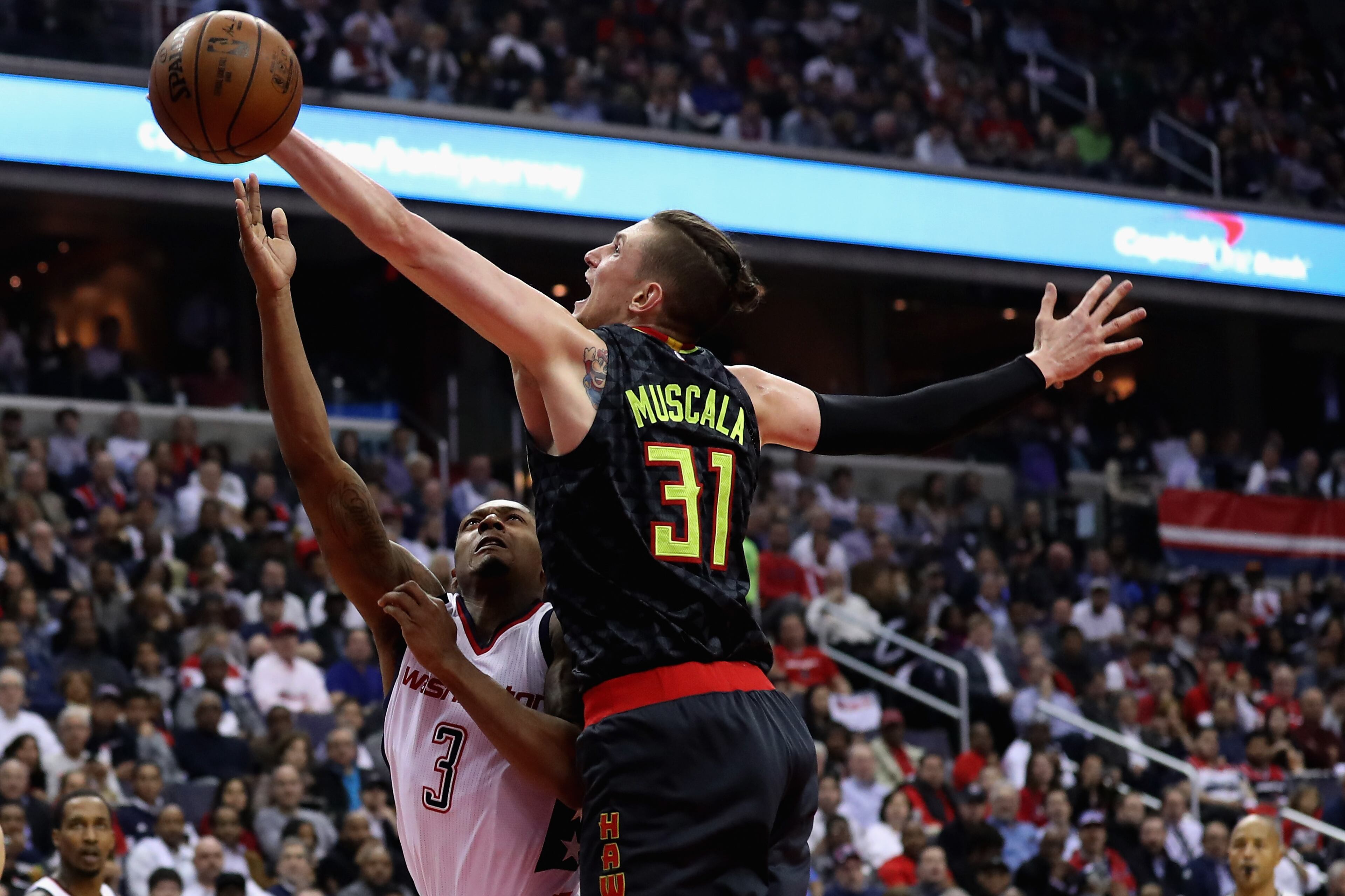 WASHINGTON, DC - APRIL 19: Mike Muscala #31 of the Atlanta Hawks blocks a shot by Bradley Beal #3 of the Washington Wizards in the first half of Game Two of the Eastern Conference Quarterfinals during the 2017 NBA Playoffs at Verizon Center on April 19, 2017 in Washington, DC. NOTE TO USER: User expressly acknowledges and agrees that, by downloading and or using this photograph, User is consenting to the terms and conditions of the Getty Images License Agreement. (Photo by Rob Carr/Getty Images)