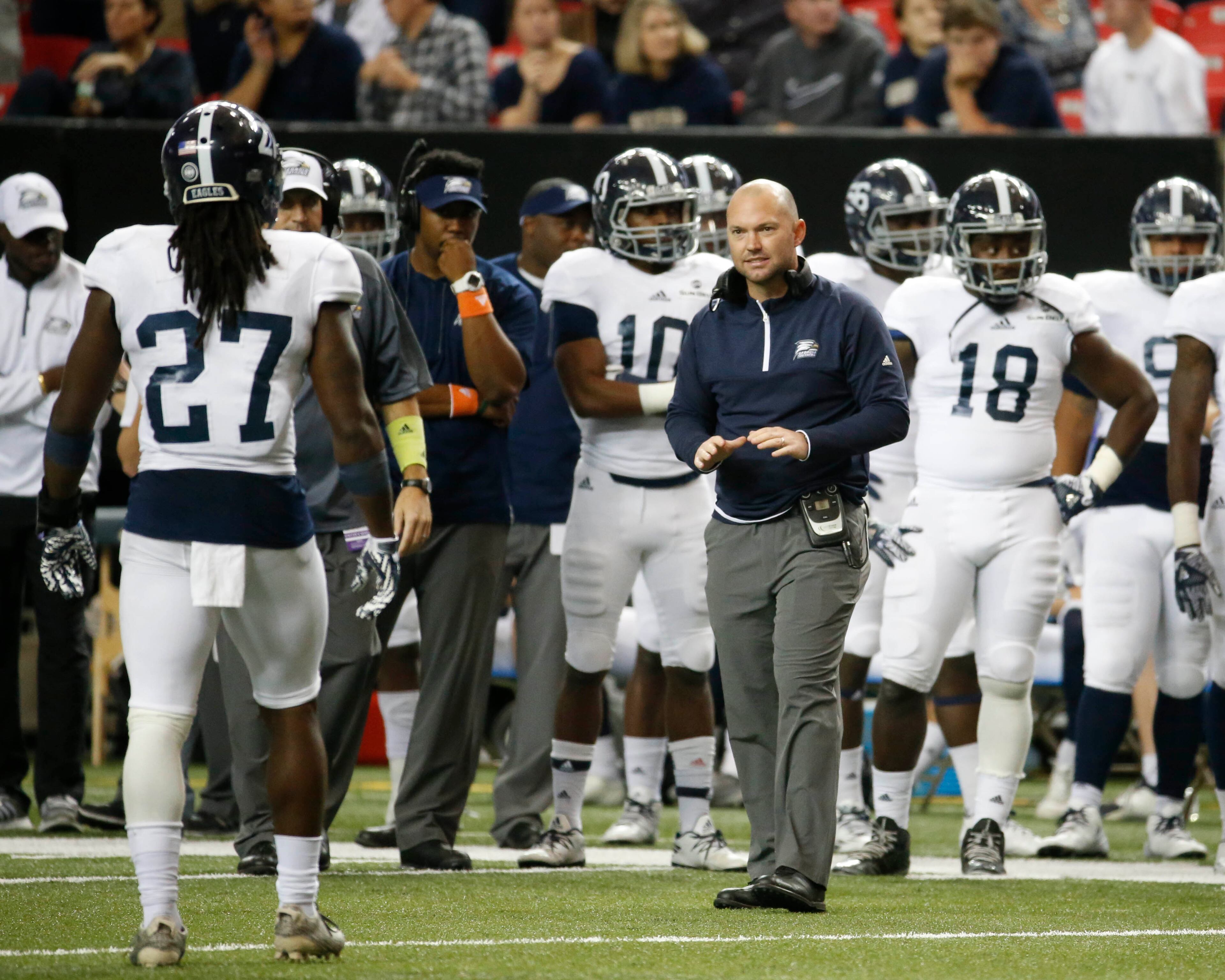 November 19, 2016 - Atlanta, Ga: Georgia Southern Eagles head coach Tyson Summers talks with linebacker Ironhead Gallon (27) in the second half of their game against the Georgia State Panthers at the Georgia Dome Saturday November 19, 2016, in Atlanta, Ga. Georgia State won 30-24. PHOTO / JASON GETZ