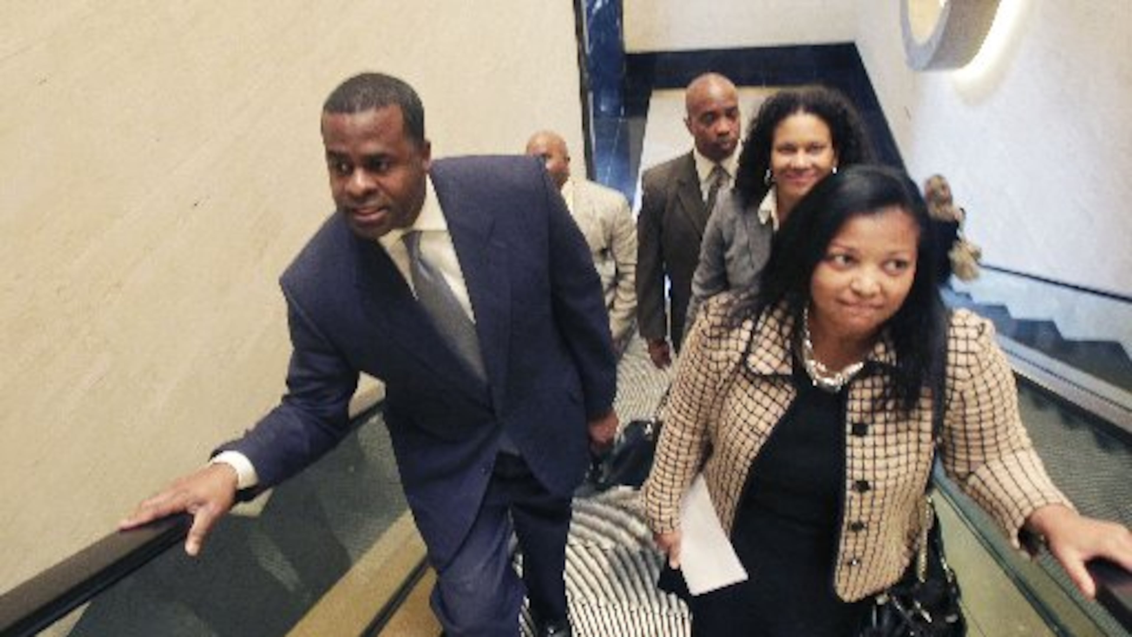 Atlanta City Attorney Cathy Hampton, seen here in a 2011 photo with Mayor Kasim Reed, will leave her position in late May, the city said Tuesday.