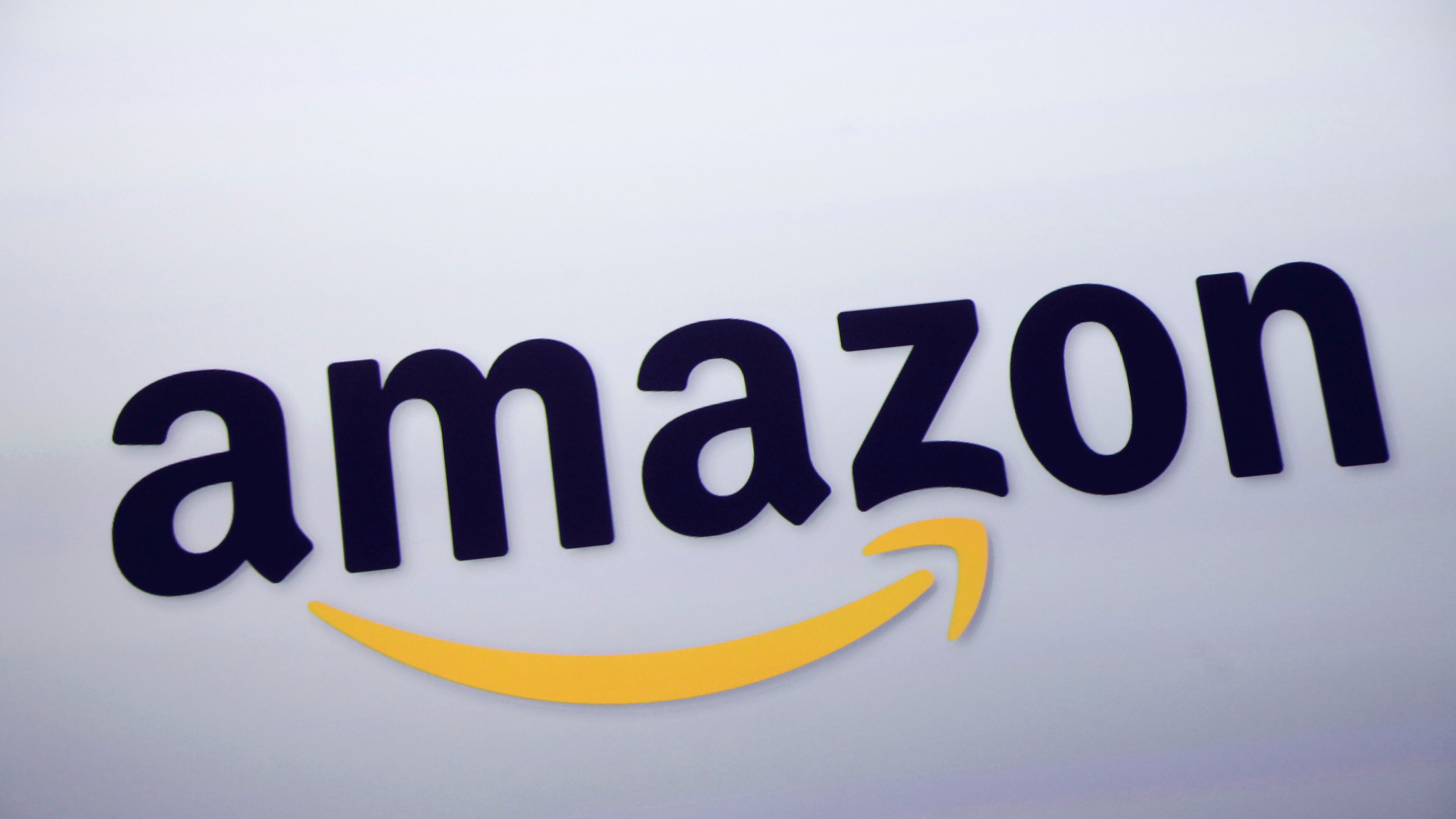 FILE - The Amazon logo is displayed at a news conference in New York on Sept. 28, 2011. (AP Photo/Mark Lennihan, File)