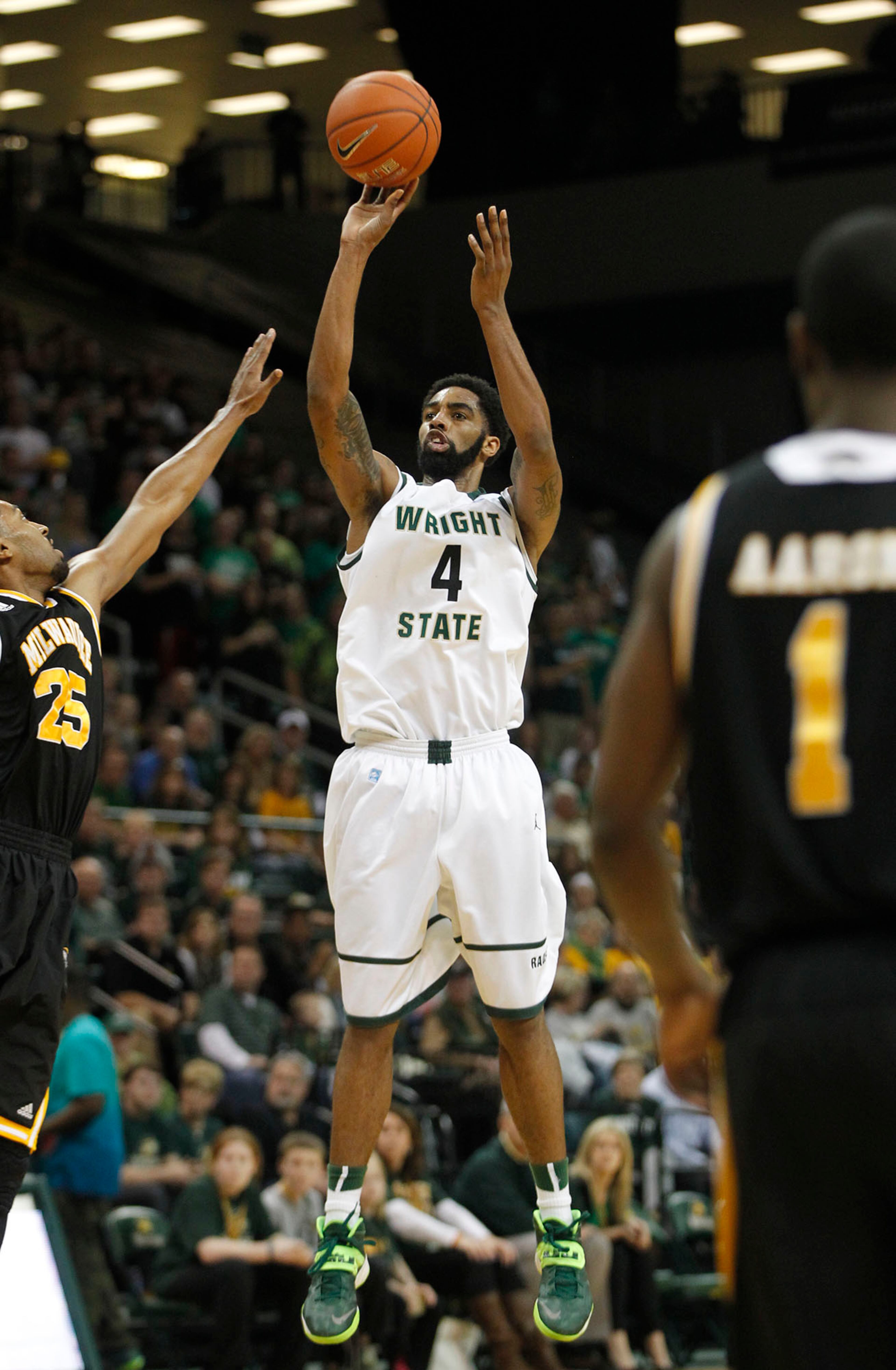 Wright State's Jerran Young up for a jumper as the Raiders hosted the Panthers for the Horizon League Championship. TY GREENLEES / STAFF