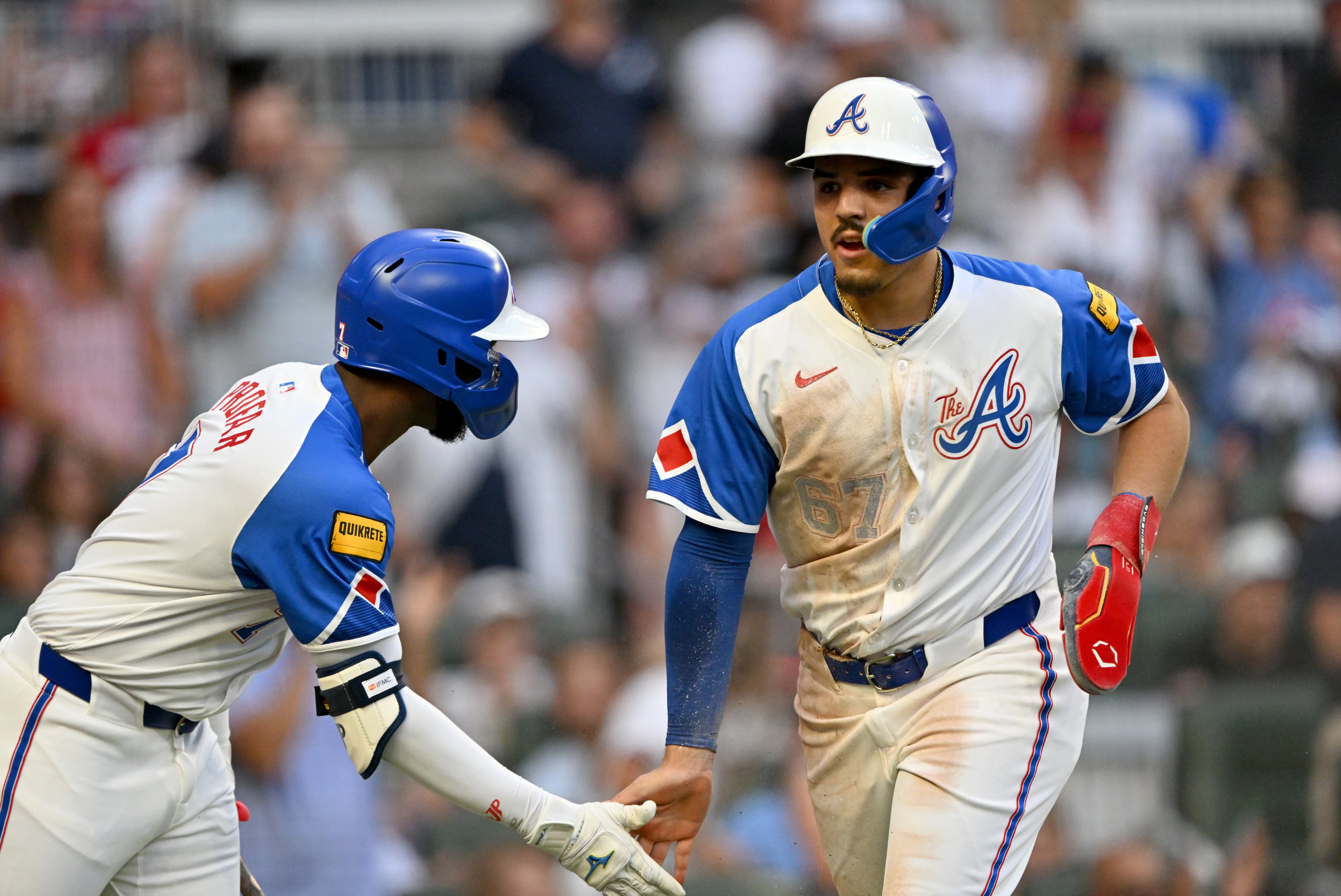 Atlanta Braves shortstop Nacho Alvarez Jr. (67) celebrates after scoring on an RBI single by Atlanta Braves shortstop Nick Allen (2) during the fourth inning of a baseball game at Truist Park, Saturday, July 19, 2025, in Atlanta. New York Yankees won 12-9 over Atlanta Braves. (Hyosub Shin / AJC)