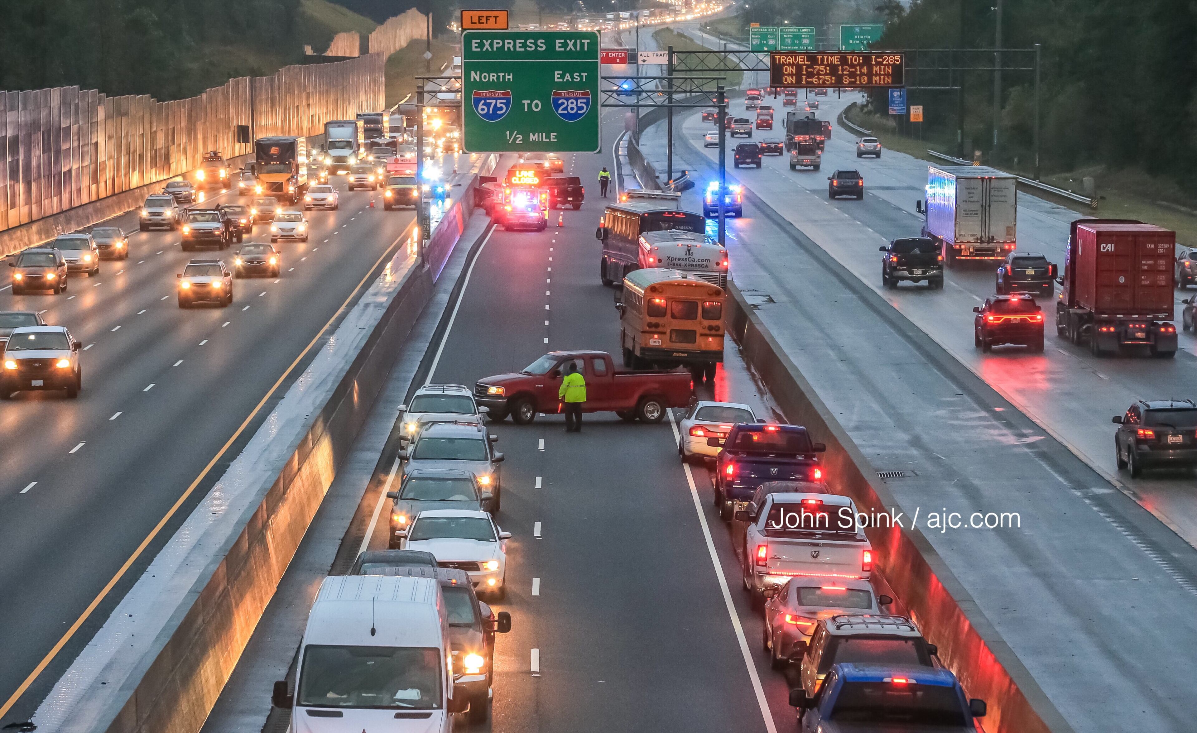 Traffic was turned around after a wrong-way crash on the express lanes in Henry County. JOHN SPINK / JSPINK@AJC.COM