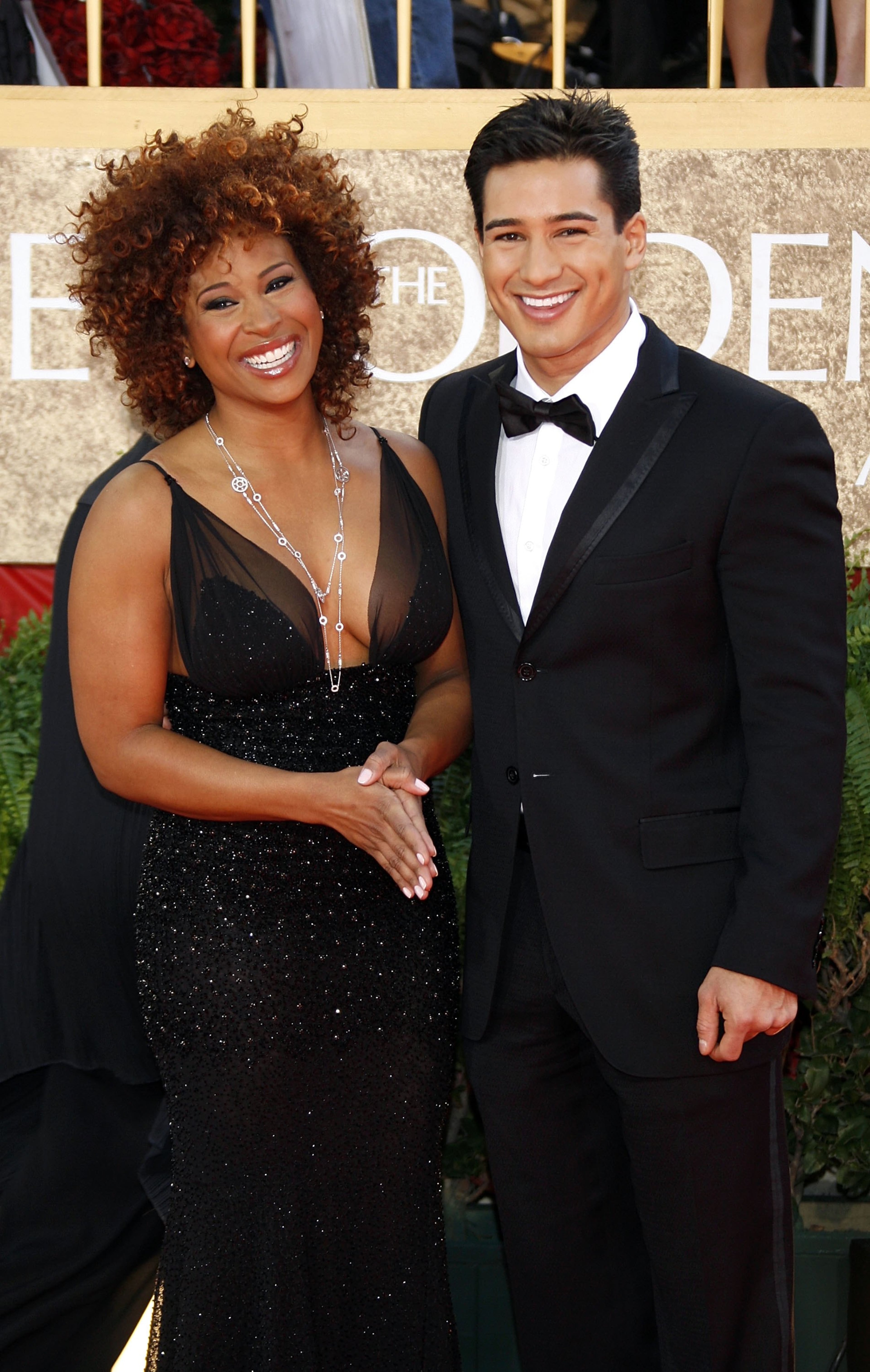 TV personality Tanika Ray (left) and actor Mario Lopez arrive at the 64th annual Golden Globe Awards at the Beverly Hilton on Jan. 15, 2007, in Beverly Hills, Calif.