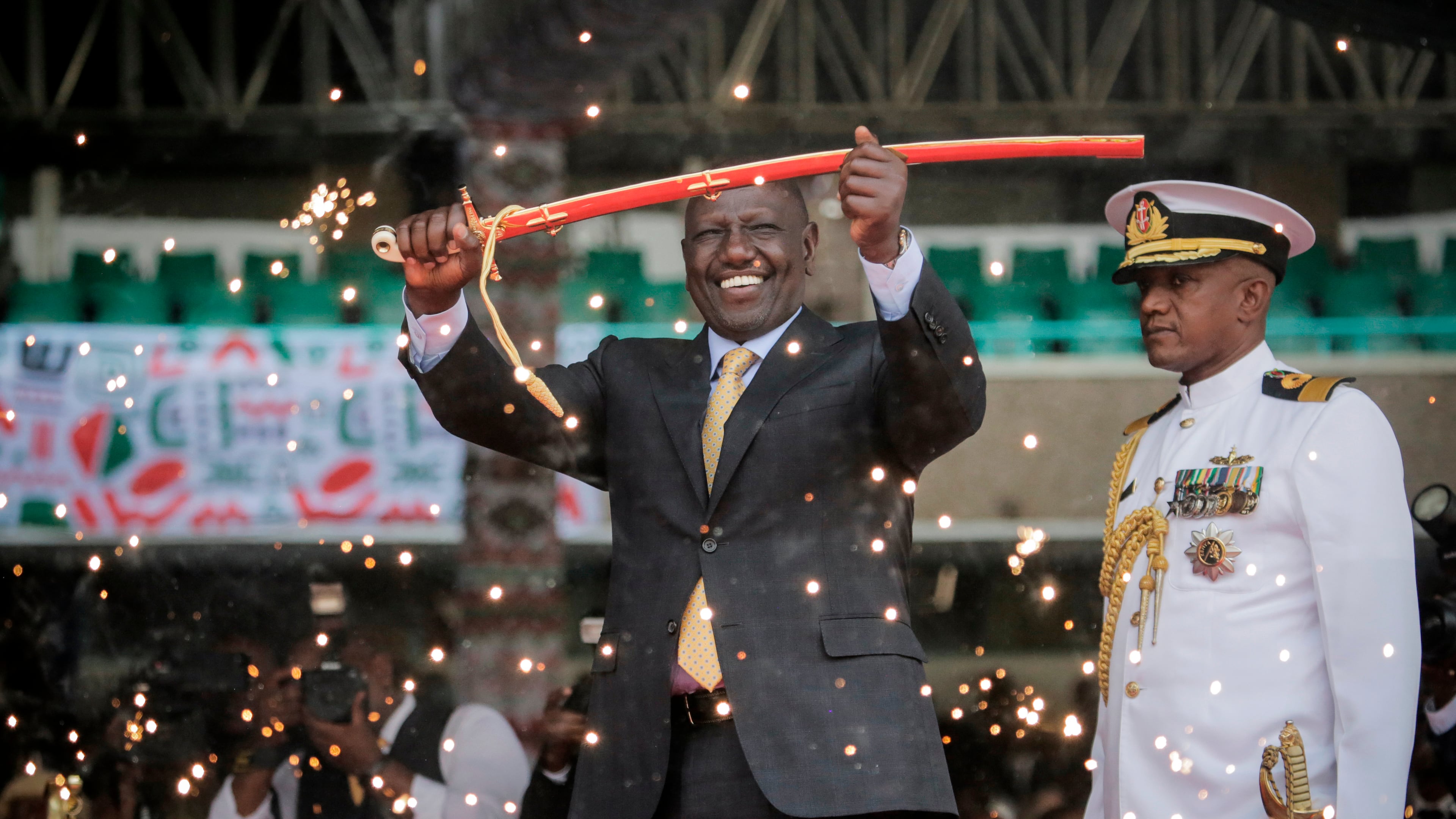 FILE - Kenya's new president William Ruto holds up a ceremonial sword as he is sworn in to office at a ceremony held at Kasarani stadium in Nairobi, Kenya Tuesday, Sept. 13, 2022. (AP Photo/Brian Inganga, File)