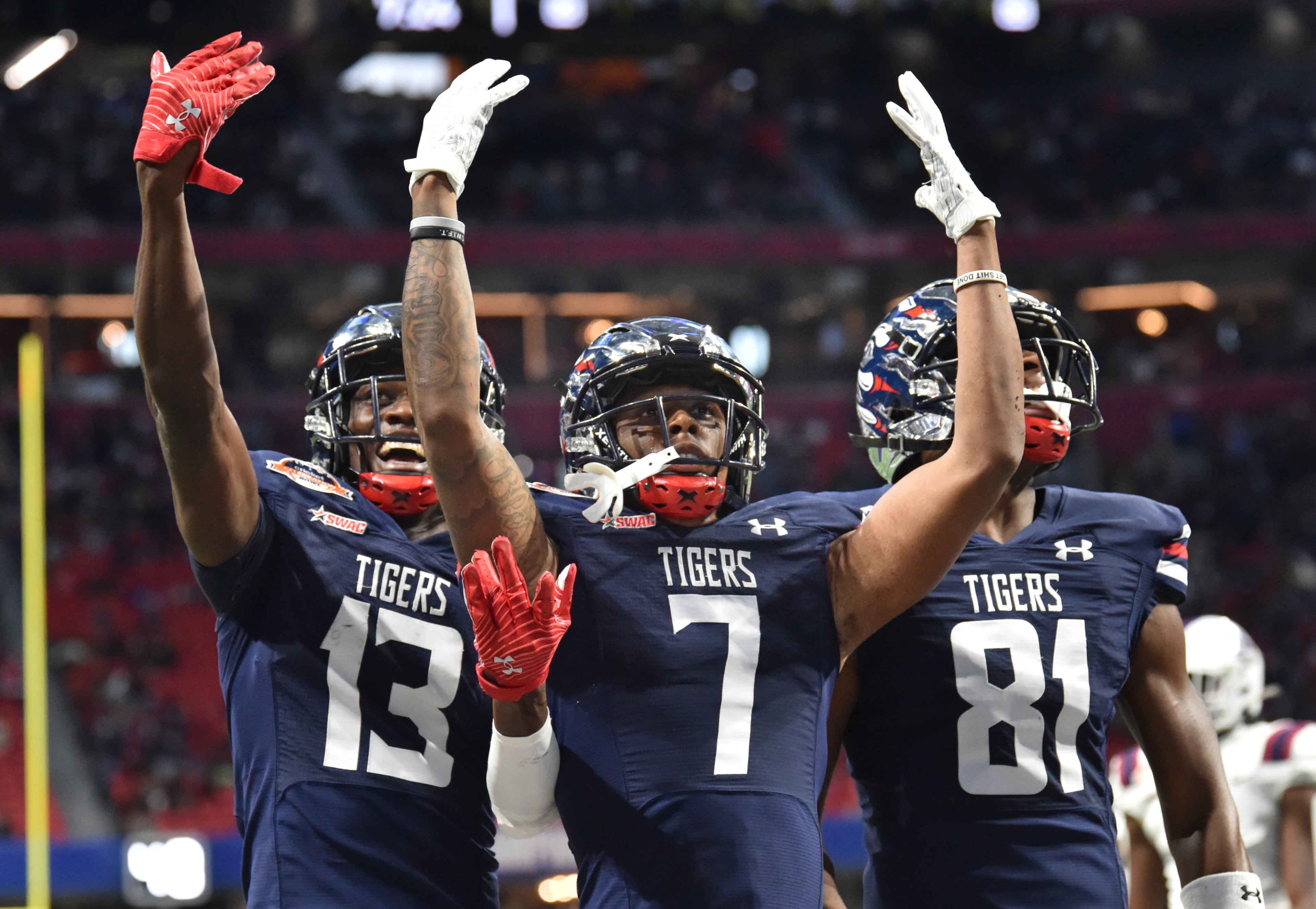 Jackson State's wide receiver Keith Corbin III (7) celebrates with teammates after scoring a touchdown during the first half of the 2021 Cricket Celebration Bowl at Mercedes-Benz Stadium in Atlanta on Saturday, December 18, 2021. (Hyosub Shin / Hyosub.Shin@ajc.com)
