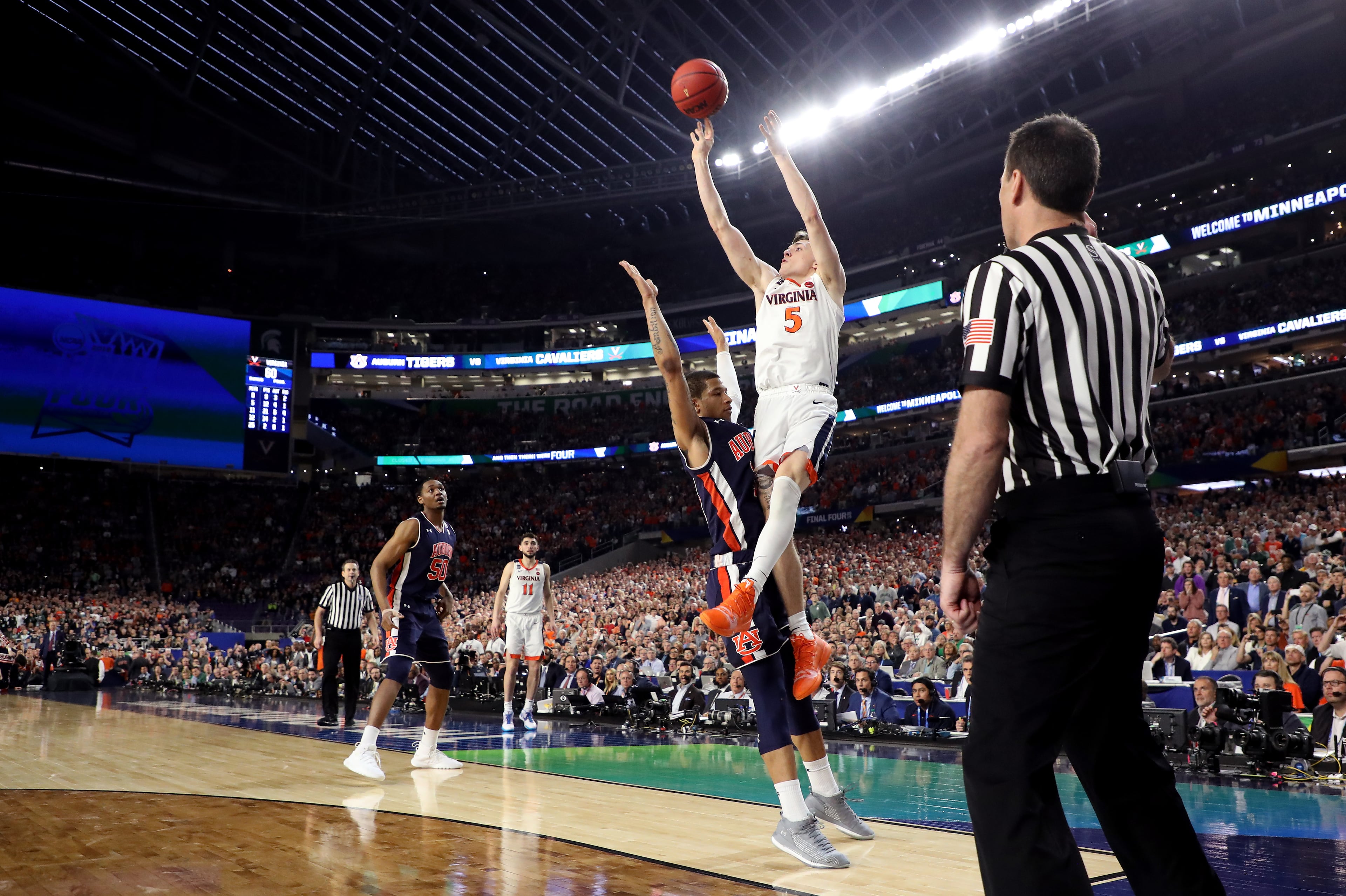 A look at the play that decided the NCAA Tournament semifinal between Virginia and Auburn Saturday in Minneapolis. With his team down by two points, Kyle Guy of Virginia attempted a three-pointer as time expired. A foul was called on Auburn's Samir Doughty. Guy made all three free throws and the Cavs advanced to the national championship game. (Photo by Streeter Lecka/Getty Images)