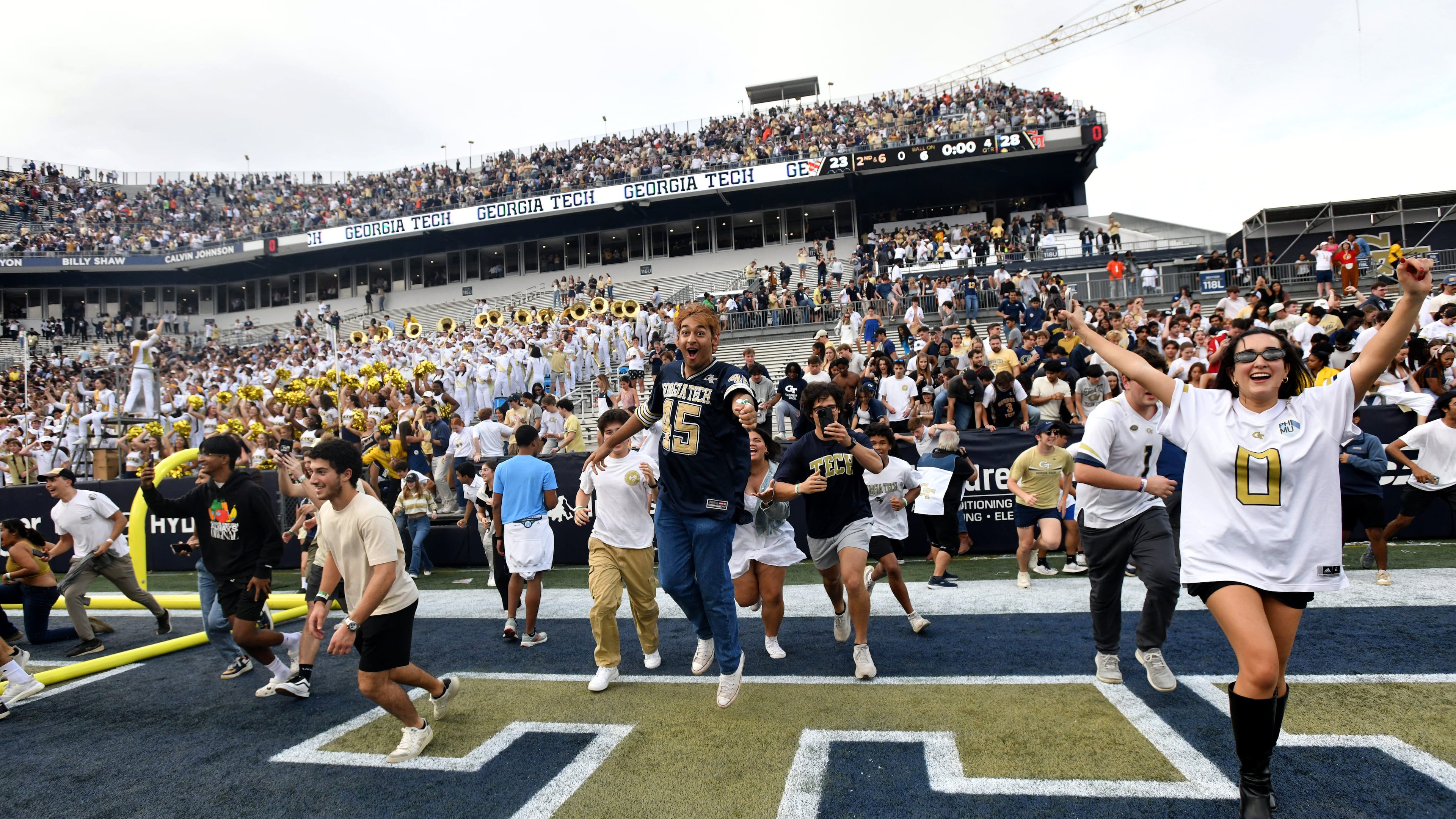 Georgia Tech fans storm the field after an NCAA college football game against Miami at Georgia Tech's Bobby Dodd Stadium, Saturday, November 9, 2024, in Atlanta. Georgia Tech won 28-23 over Miami. (Hyosub Shin / AJC)