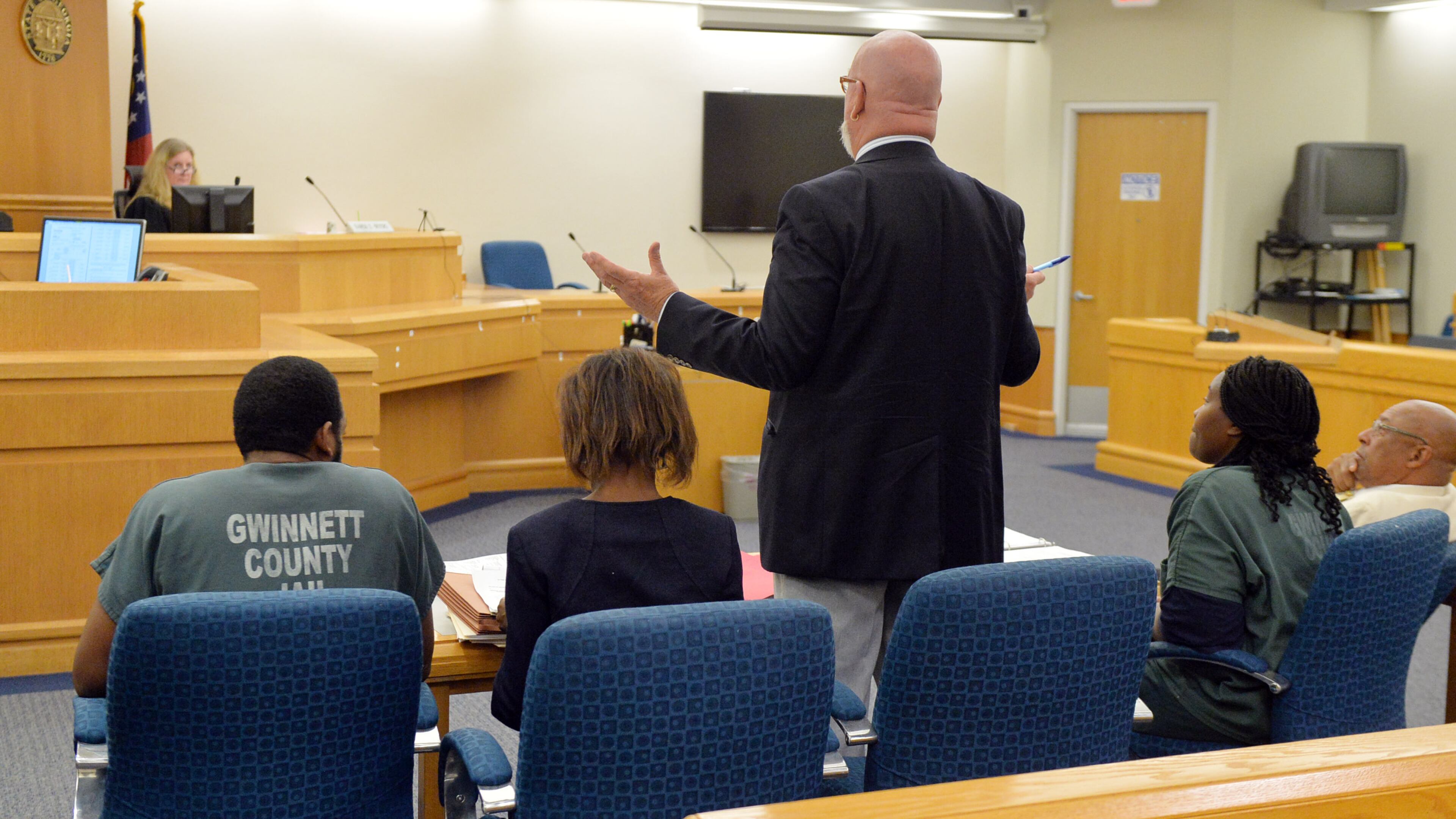 Defense attorney Jeff Sliz presents an argument as Recardo and Therian Wimbush appear before Gwinnett County Superior Court Judge Karen Beyers during a bond hearing Tuesday, August 5, 2014. The former Georgia Tech football star and his wife were denied bond. They are accused of locking their 13 year old son in the basement for months. KENT D. JOHNSON/KDJOHNSON@AJC.COM