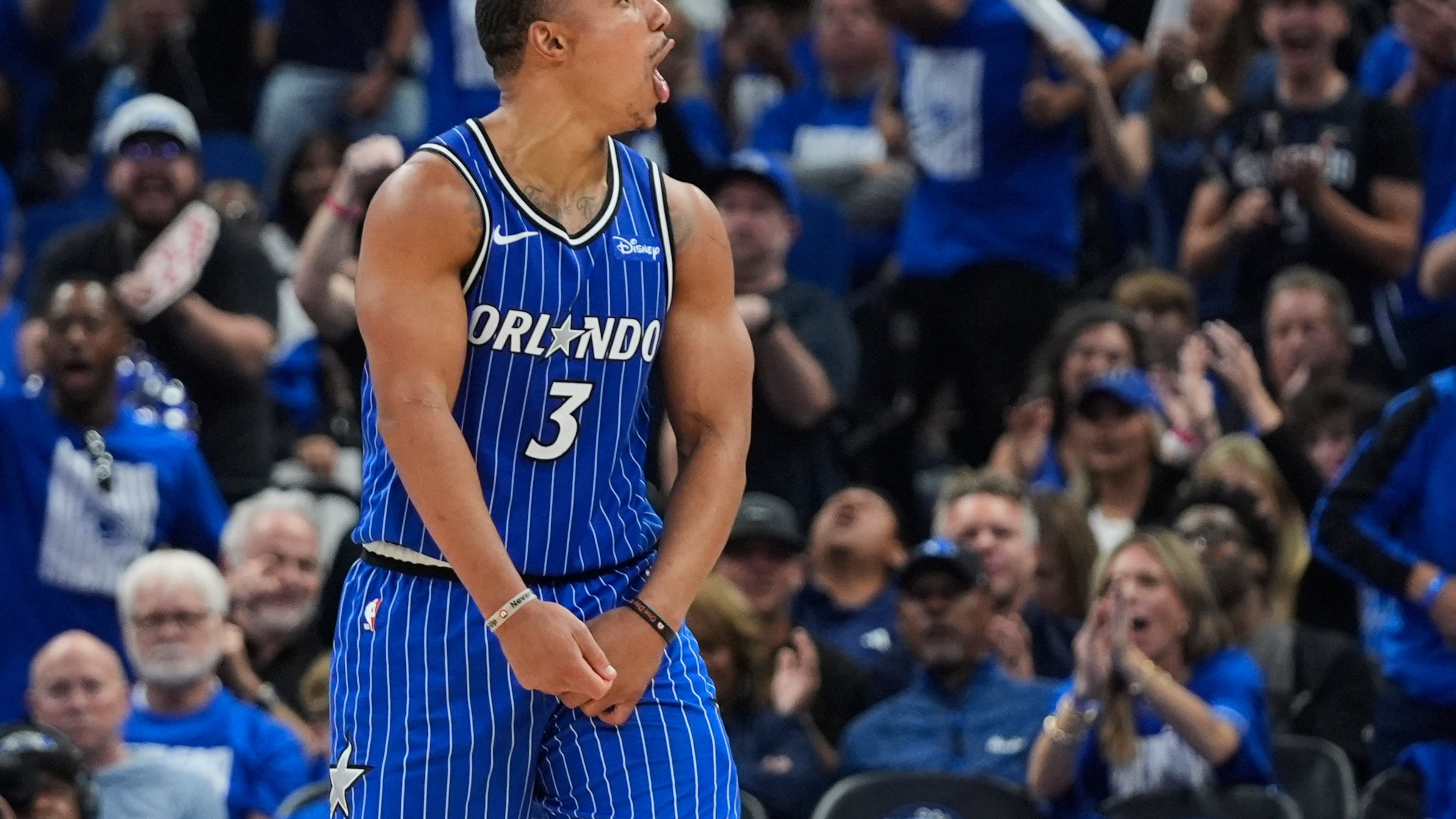 Orlando Magic guard Desmond Bane (3) cheers with fans after a Detroit Pistons turnover during the second half in Game 4 of a first-round NBA basketball playoff series, Monday, April 27, 2026, in Orlando, Fla. (AP Photo/John Raoux)