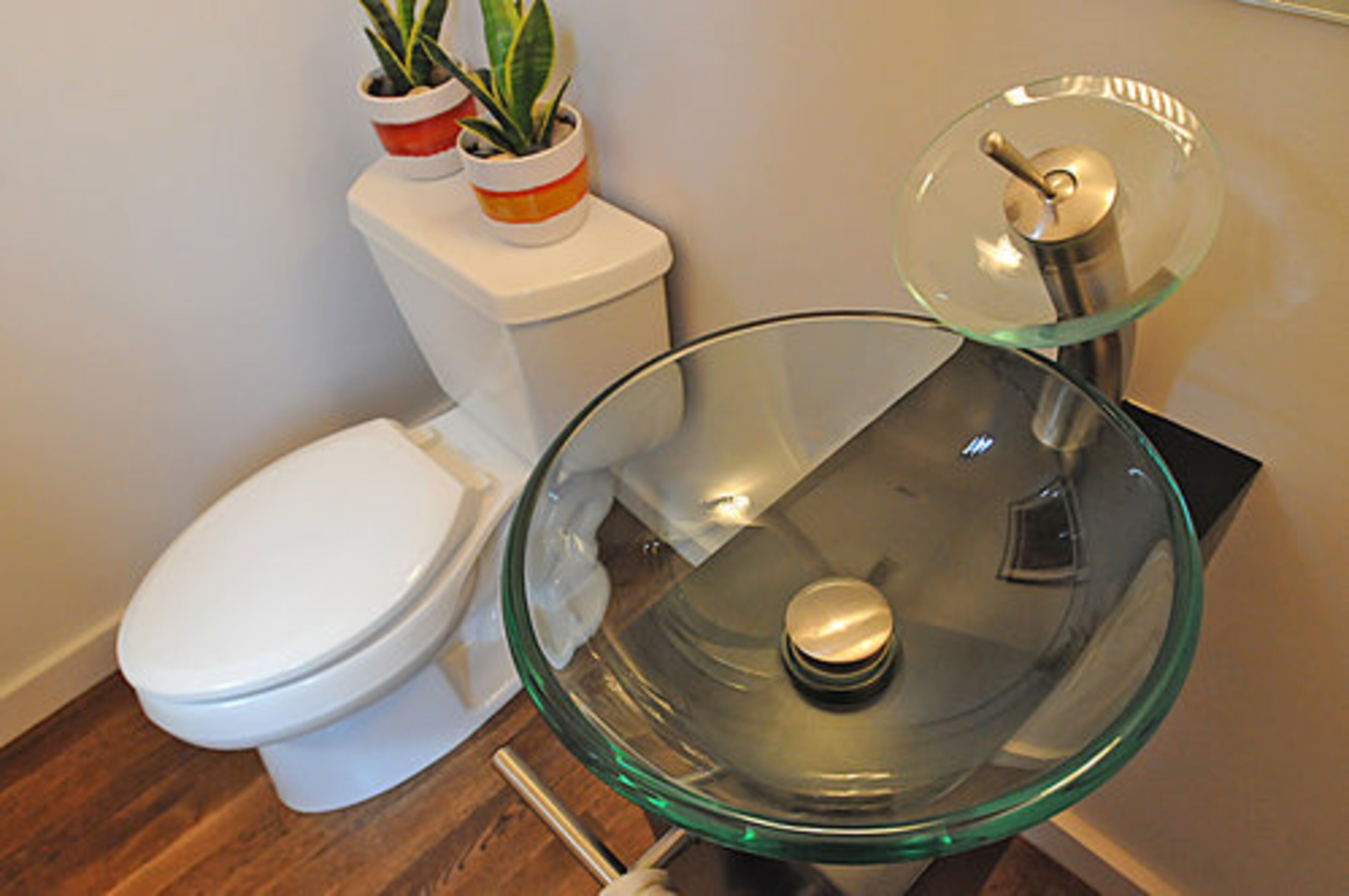 All EarthCraft homes are required to have energy-efficient toilets. But one doesn't have to sacrifice style to be eco-friendly, as the gorgeous see-through sink illustrates.