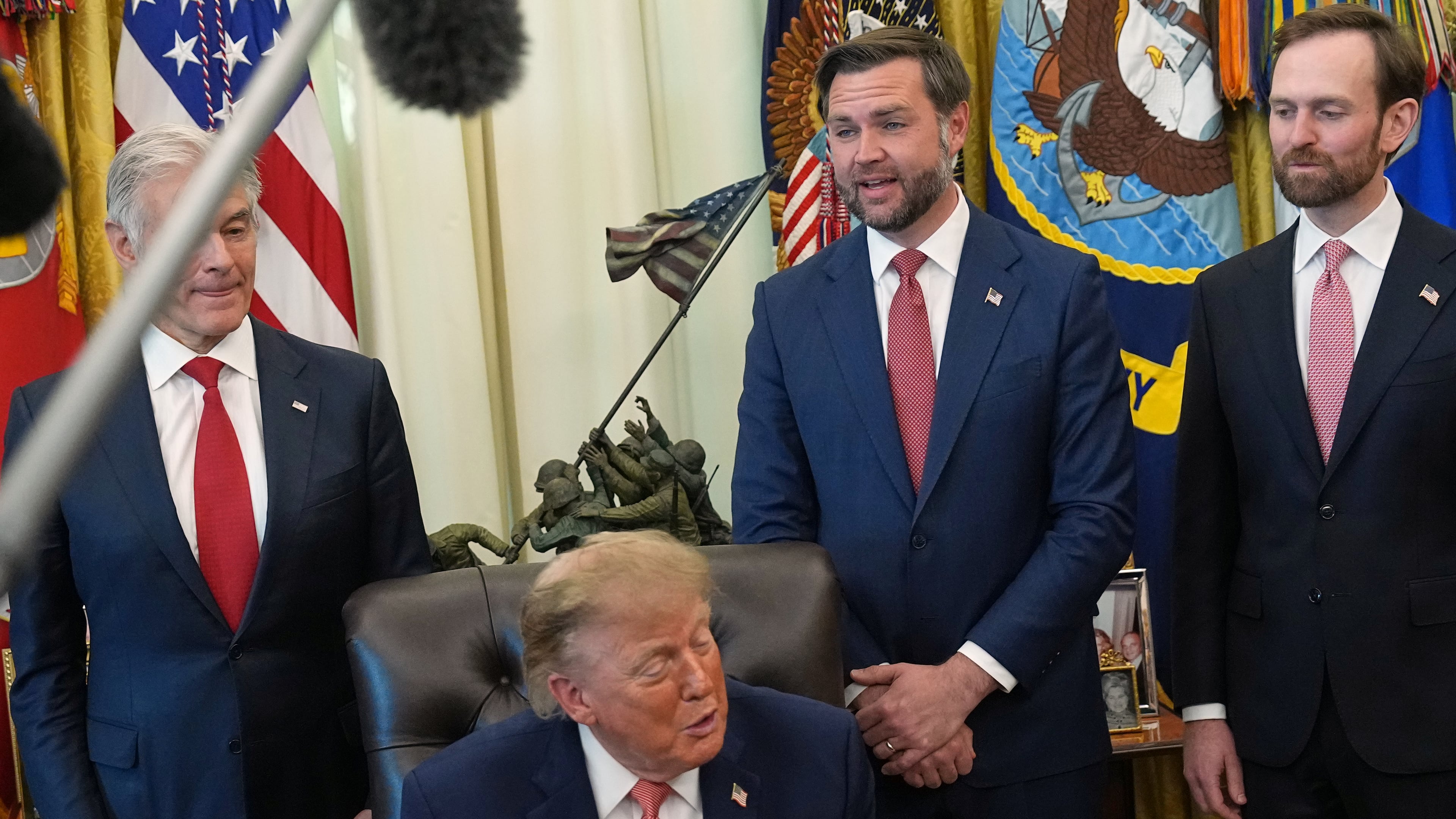President Donald Trump speaks in the Oval Office of the White House, Tuesday, Oct. 20, 2026, in Washington, as Centers for Medicare & Medicaid Services administrator Dr. Mehmet Oz, Vice President JD Vance and Andrew Ferguson, chairman of the Federal Trade Commission listen. (AP Photo/Jacquelyn Martin)