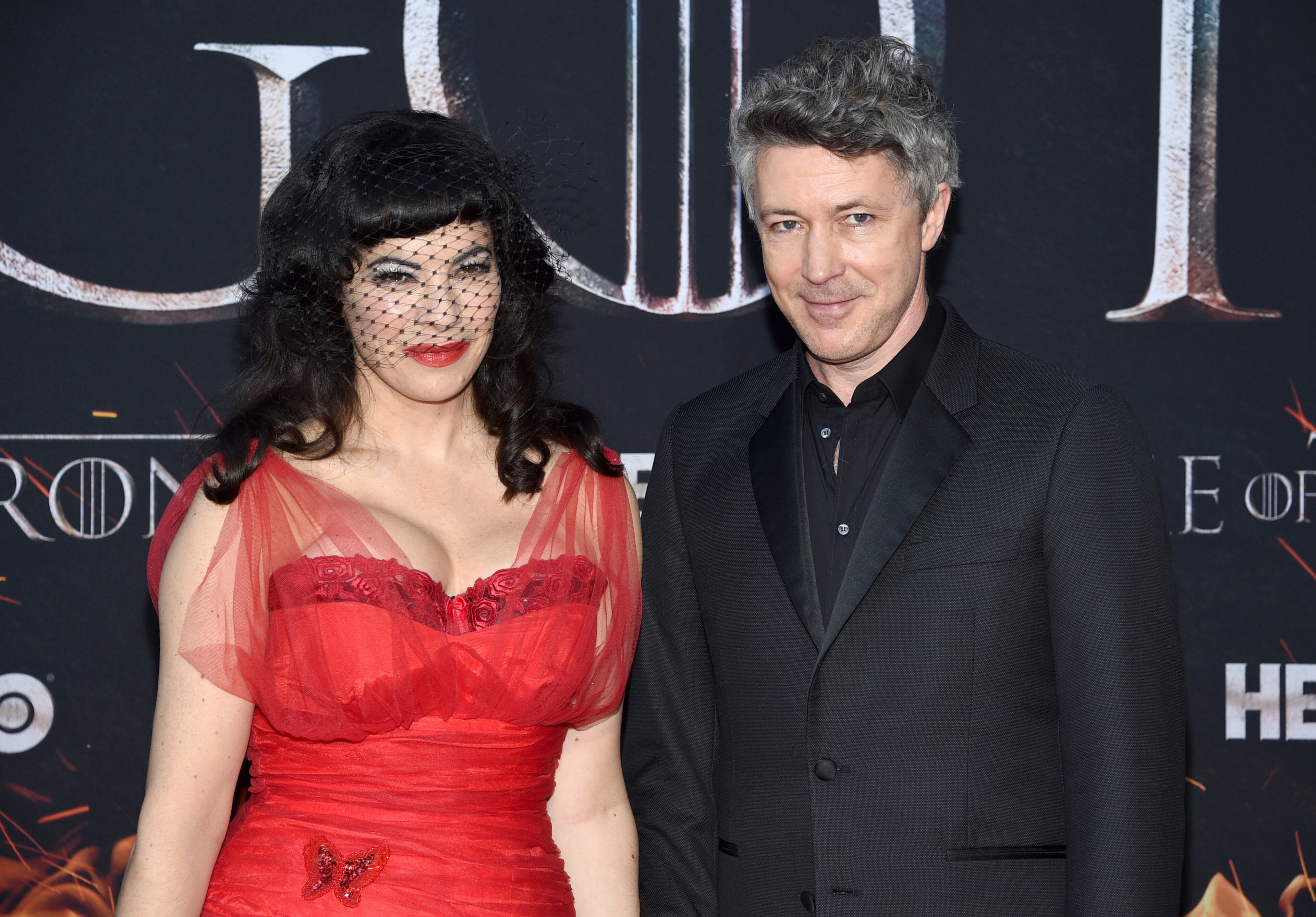 Aidan Gillen, right, and Camille O'Sullivan attend HBO's "Game of Thrones" final season premiere at Radio City Music Hall on Wednesday, April 3, 2019, in New York. (Photo by Evan Agostini/Invision/AP)