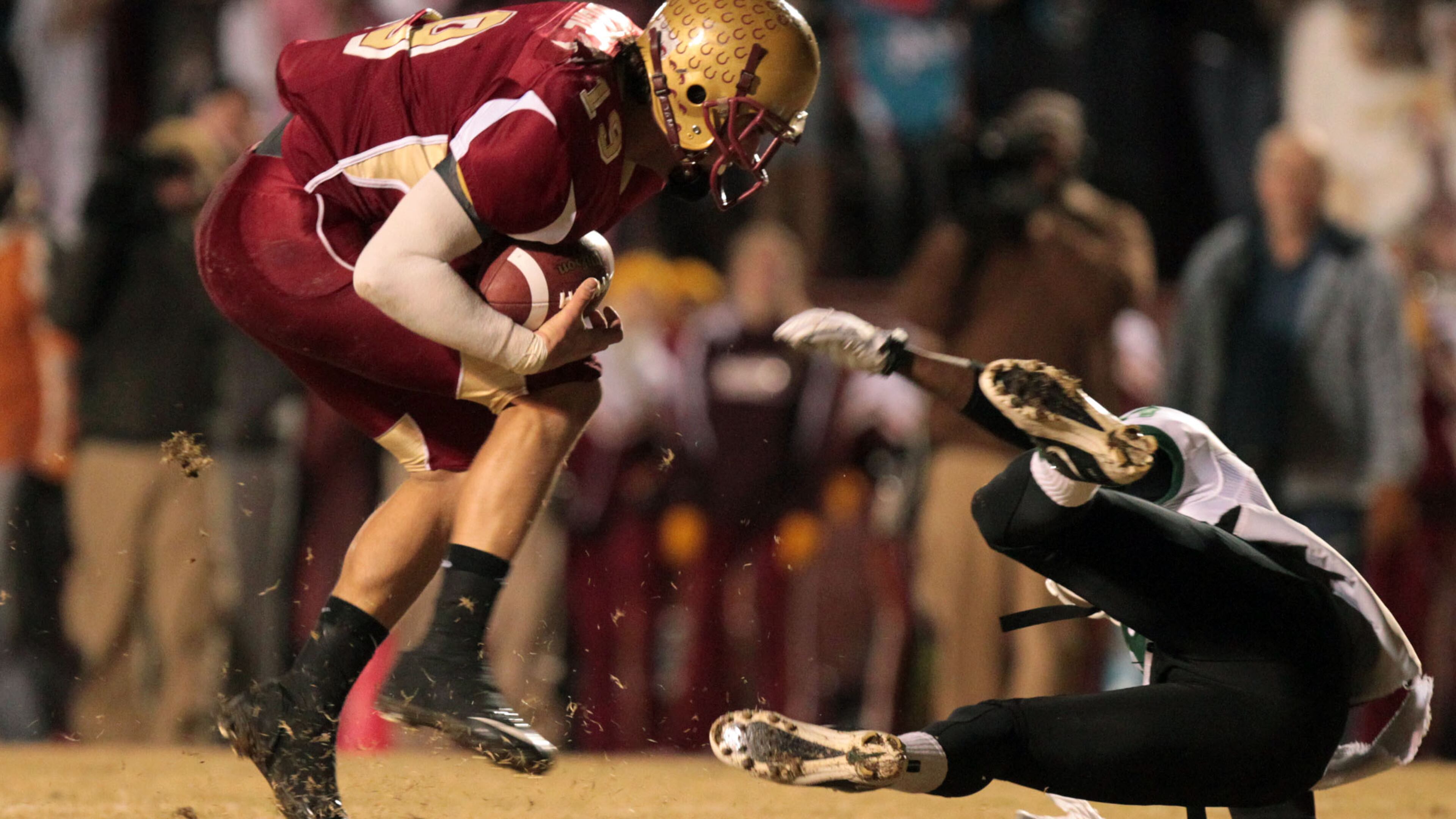 Brookwood defender Nick Moore, left, makes an interception next to Collins Hill wide receiver Zay Howard, right, in the Class AAAAA semifinals at Brookwood Community Stadium Friday night in Snellville, Ga., Dec. 3, 2010. Brookwood won 26-7 over Collins Hill.