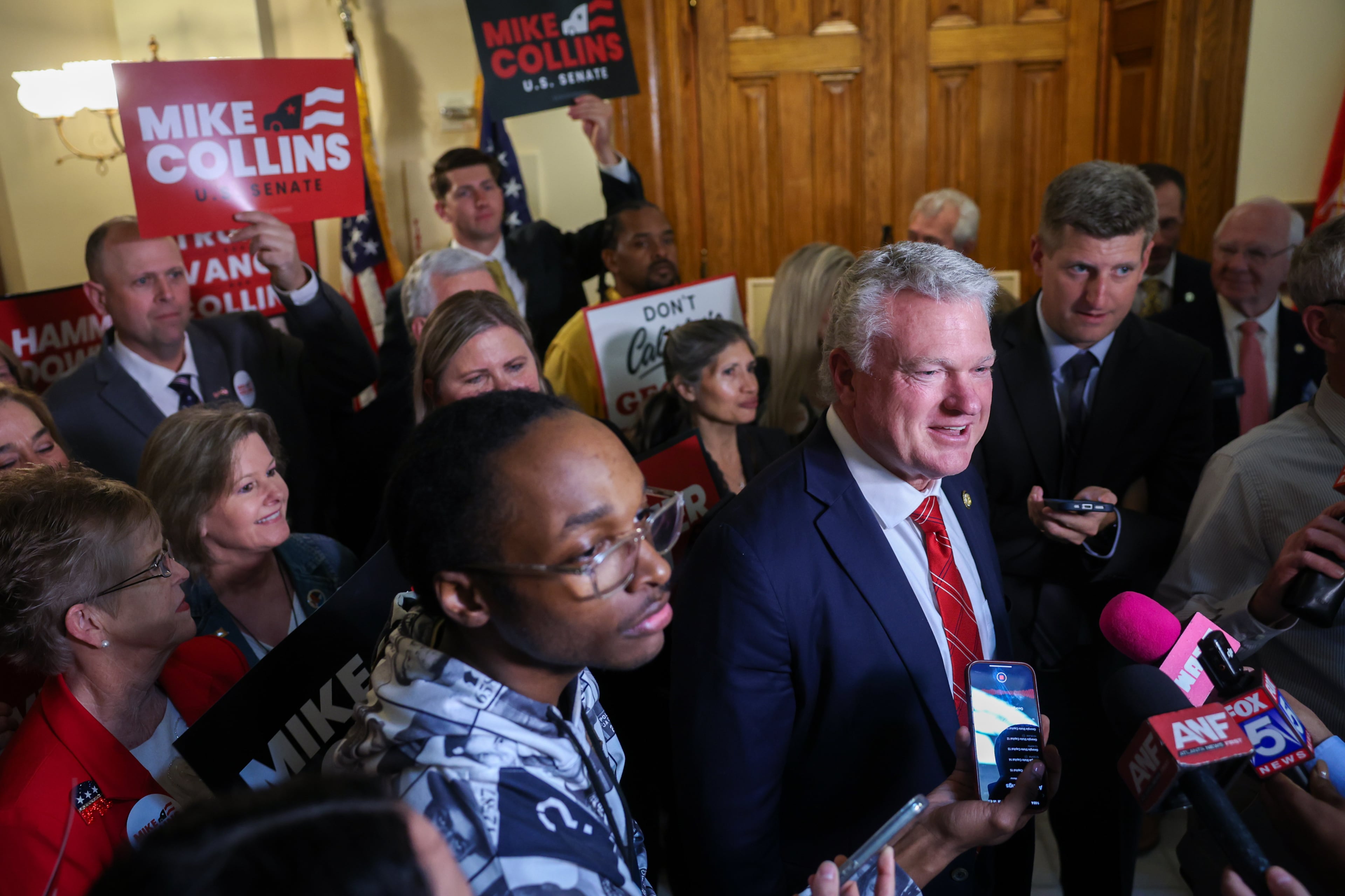 U.S. Rep. Mike Collins, R-Jackson, files his paperwork Friday. He is the early front-runner among Republicans who have made up their minds already. (Arvin Temkar/AJC)