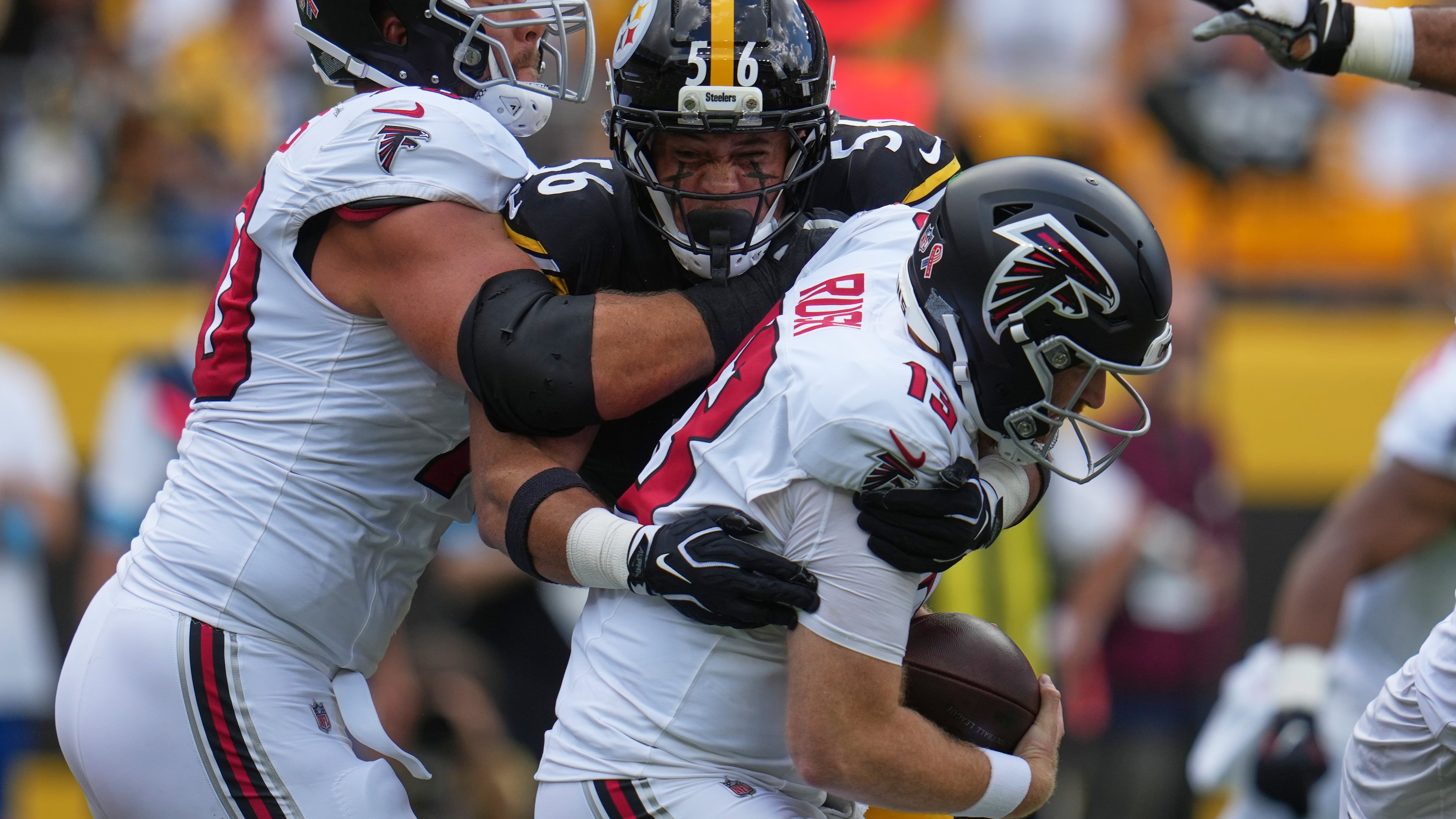 Atlanta Falcons quarterback Cooper Rush (13) is sacked by Pittsburgh Steelers linebacker Alex Highsmith (56) during an NFL football game Sunday, Sept. 13, 2026, in Pittsburgh. (AP Photo/Gene J. Puskar)