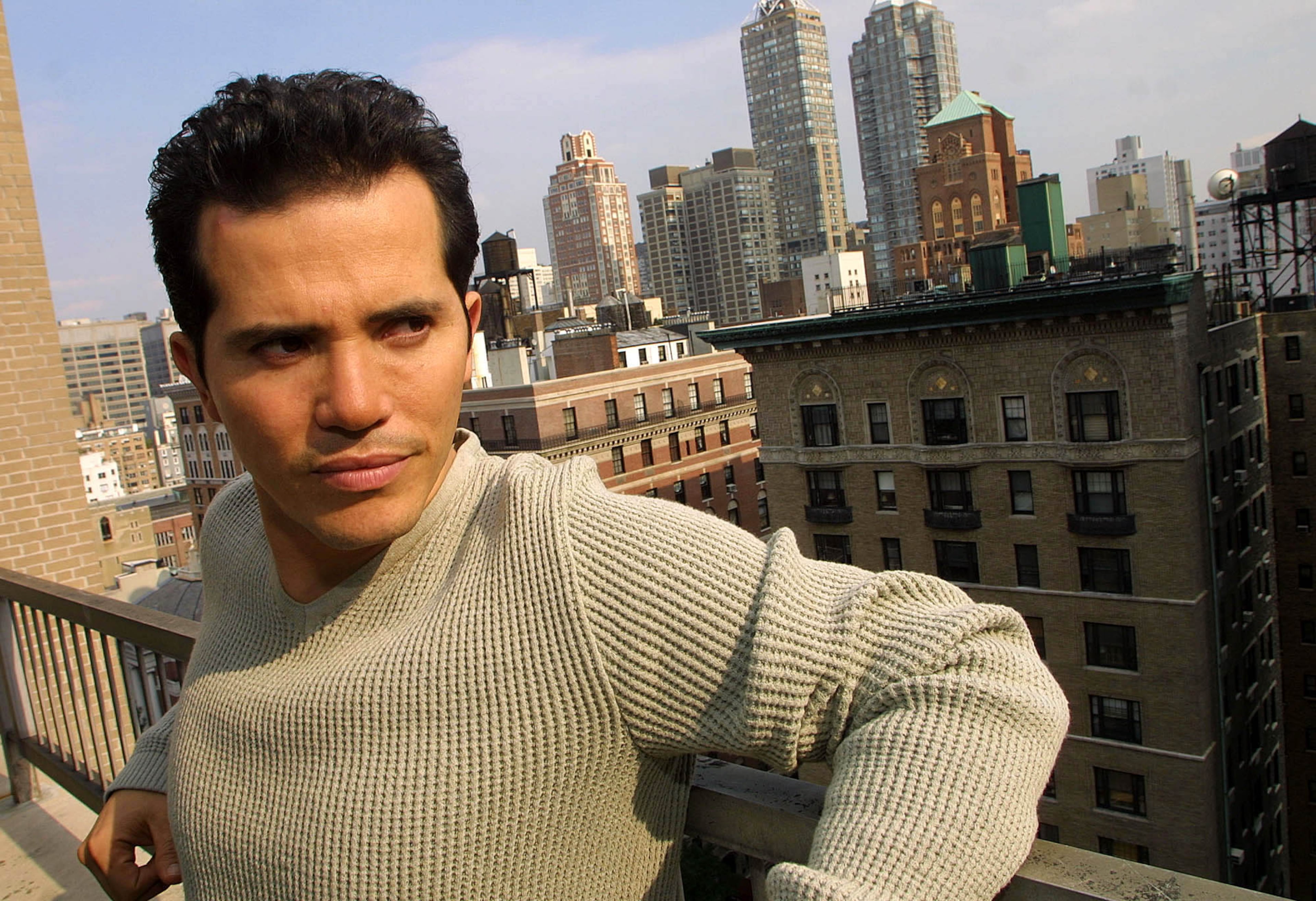 Actor John Leguizamo poses on the balcony of his New York hotel room during a photo session Oct. 22, 2001. He was born July 22, 1964.
