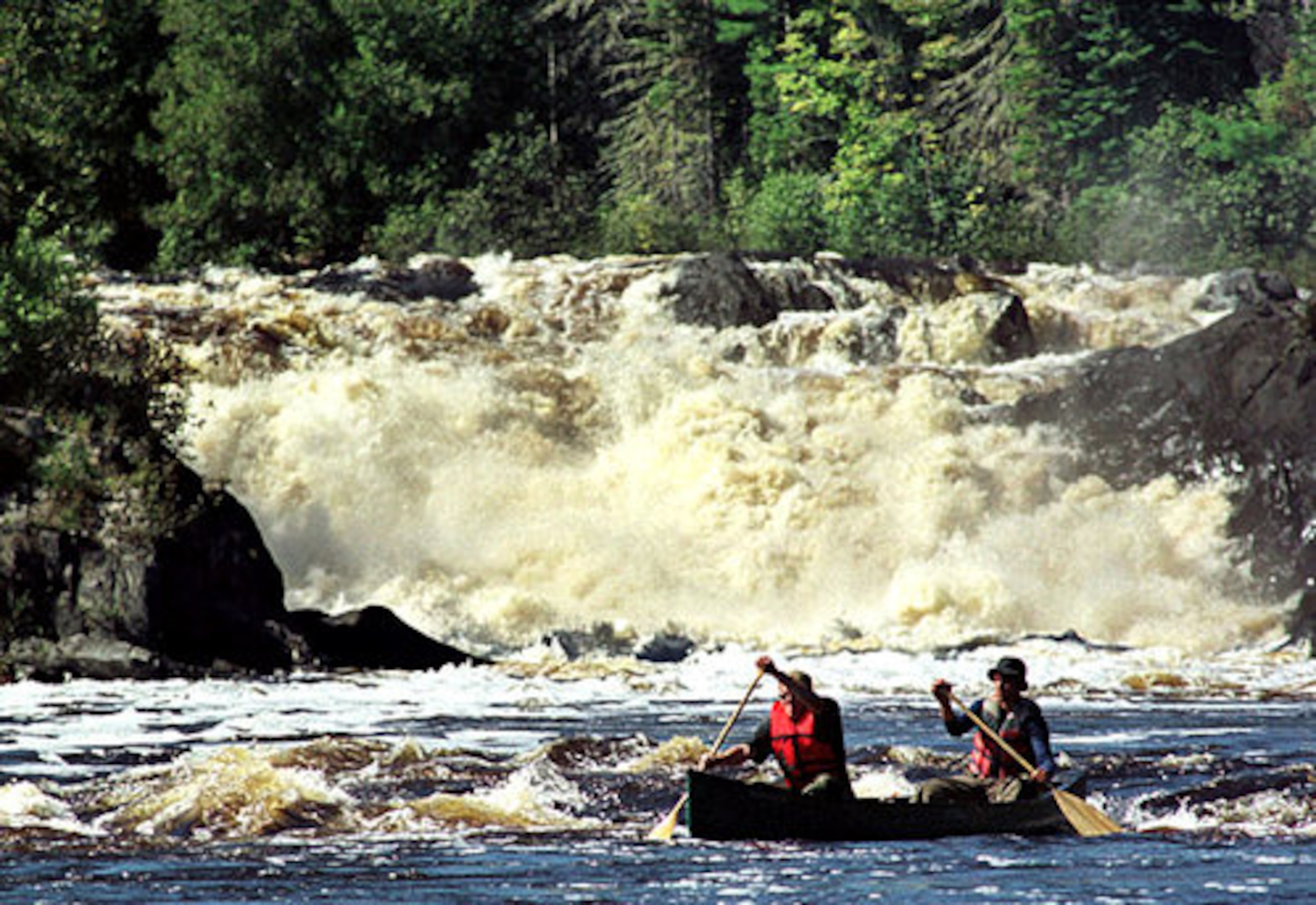 Travelers want to go on a walking tour, climb a mountain and kayak down a river - adventures that can make a vacation more meaningful.Canoeists Jason Chamberlain (left) and Andrew Martin, both of Fort Kent, Maine, paddle through whitewater after portaging the 40-foot Allagash Falls (background) in 1999 on the Allagash Wilderness Waterway in northern Maine.