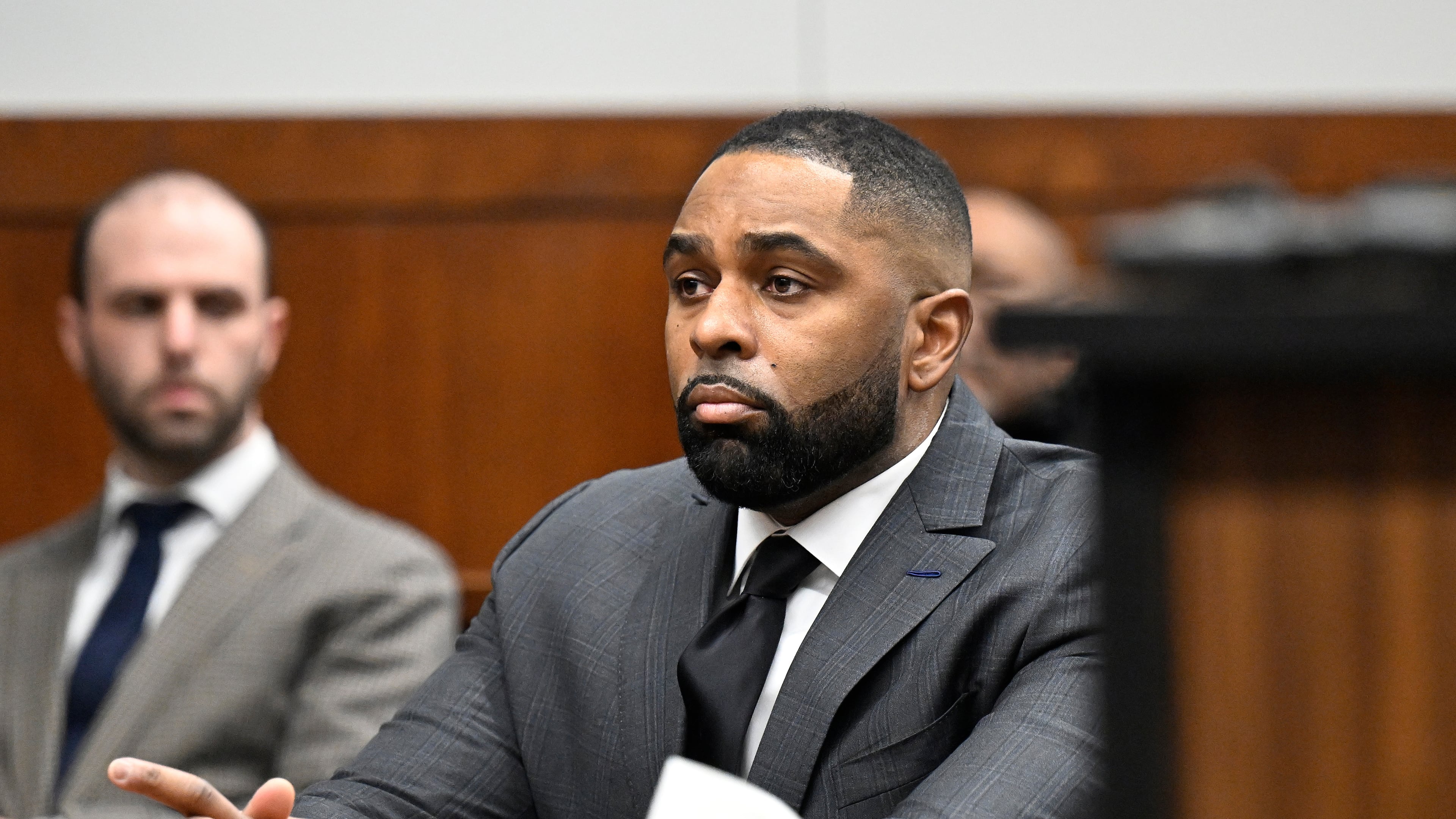 Former Michigan football coach Sherrone Moore, center, appears in the courtroom, Thursday, Jan. 22, 2026, in Ann Arbor, Mich. (AP Photo/Jose Juarez)