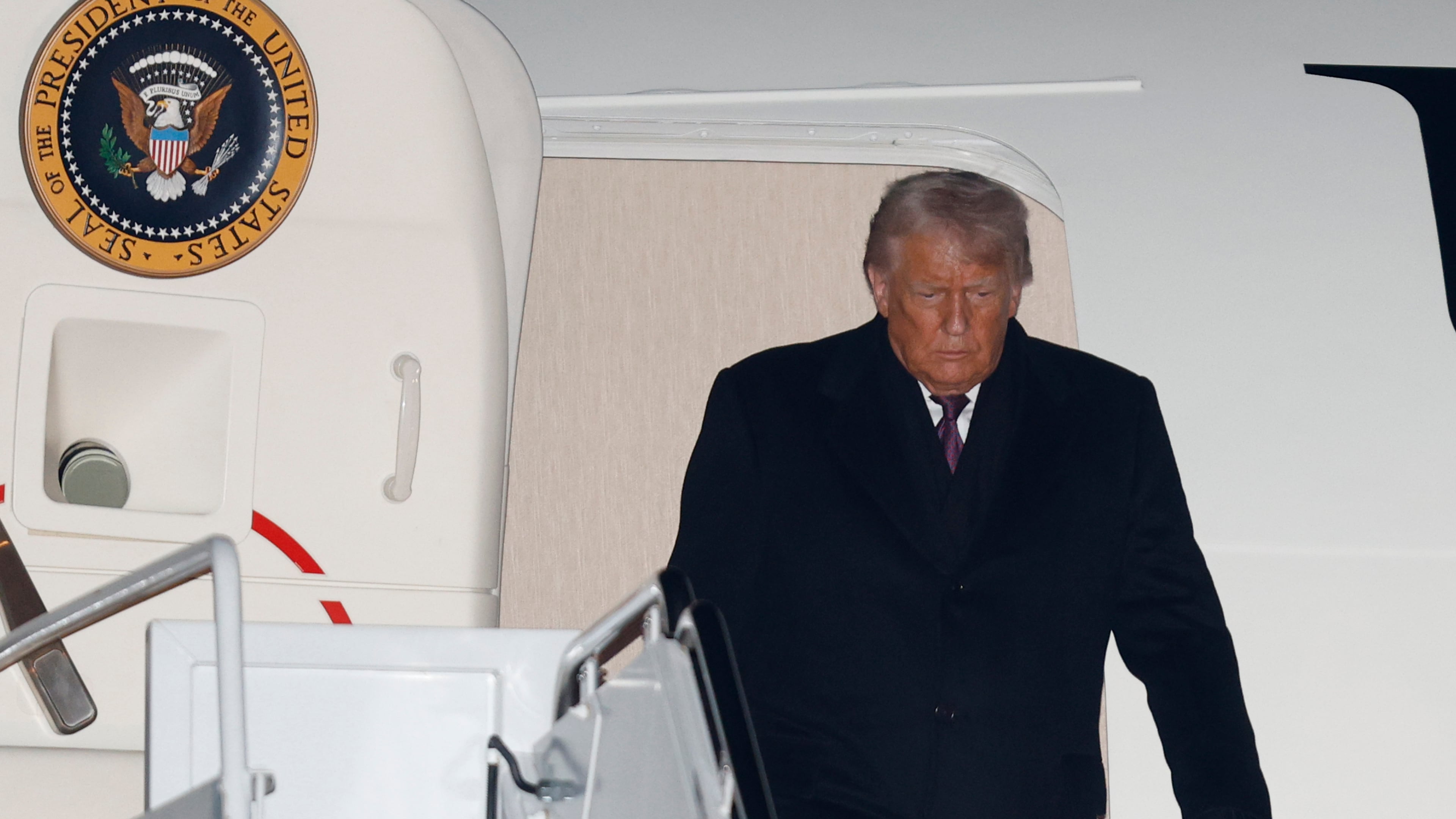 President Donald Trump arrives on Air Force One at Joint Base Andrews, Md., Thursday, Jan. 22, 2026, after returning from the World Economic Forum in Davos.(AP Photo/Luis M. Alvarez)