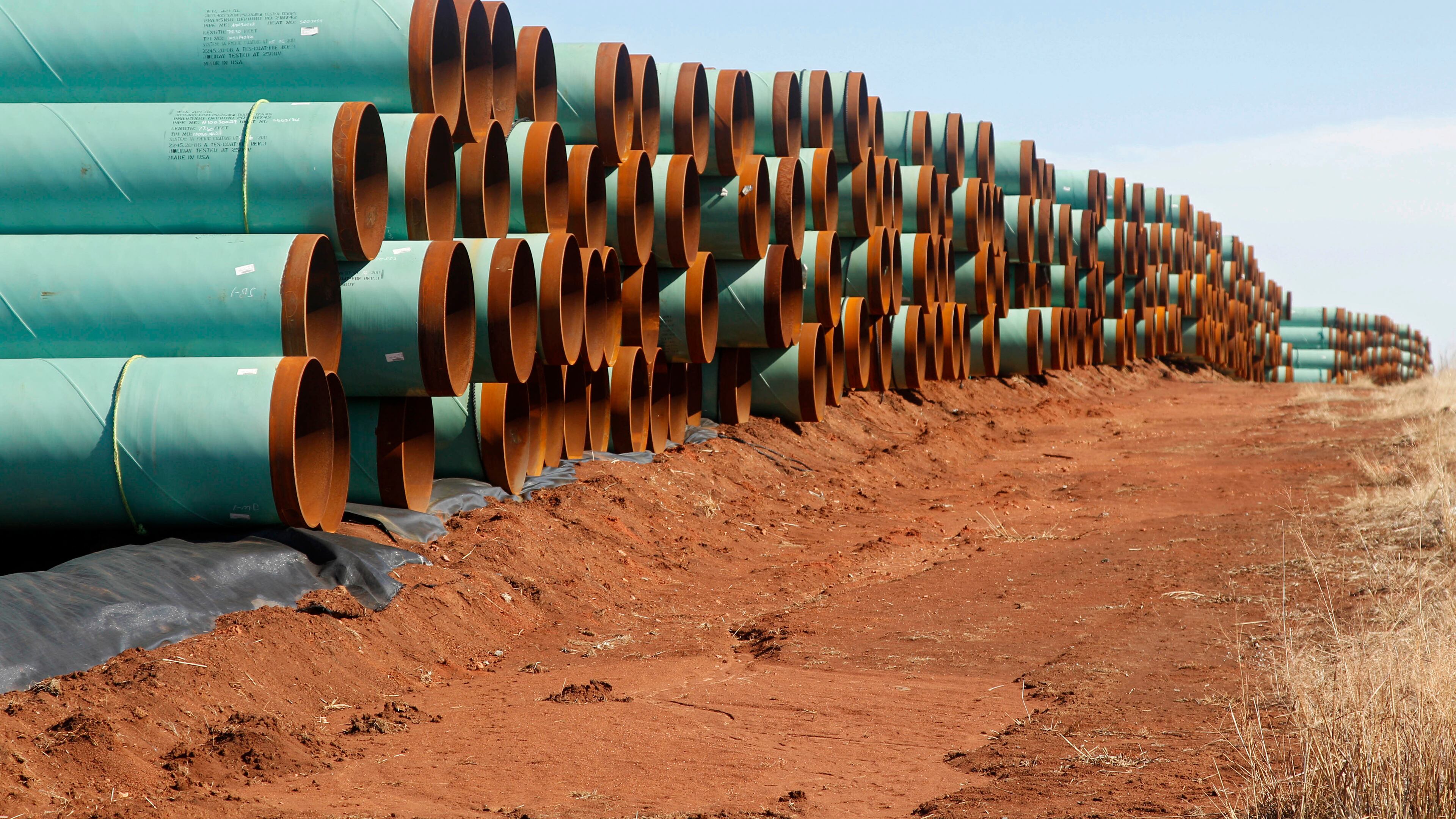 FILE - In this Wednesday, Feb. 1, 2012, file photo, miles of pipe ready to become part of the Keystone Pipeline are stacked in a field near Ripley, Okla. The pipeline battle is just the start of President Barack Obama's fight with Congress on climate change. (AP Photo/Sue Ogrocki, File) Miles of pipe ready to become part of the Keystone Pipeline are stacked in a field near Ripley, Okla. AP file/Sue Ogrocki